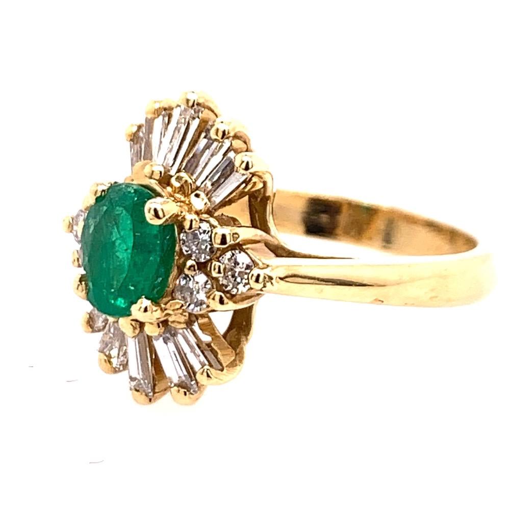 The centerstone is a Natural Oval Green Emerald weighing approximately 0.75 carats, measuring 6.5x5.1mm. 

Set in the mounting are 6 round brilliant and 10 baguette shaped natural G-H color and VS-SI clarity diamonds weighing 0.55 carats.

The