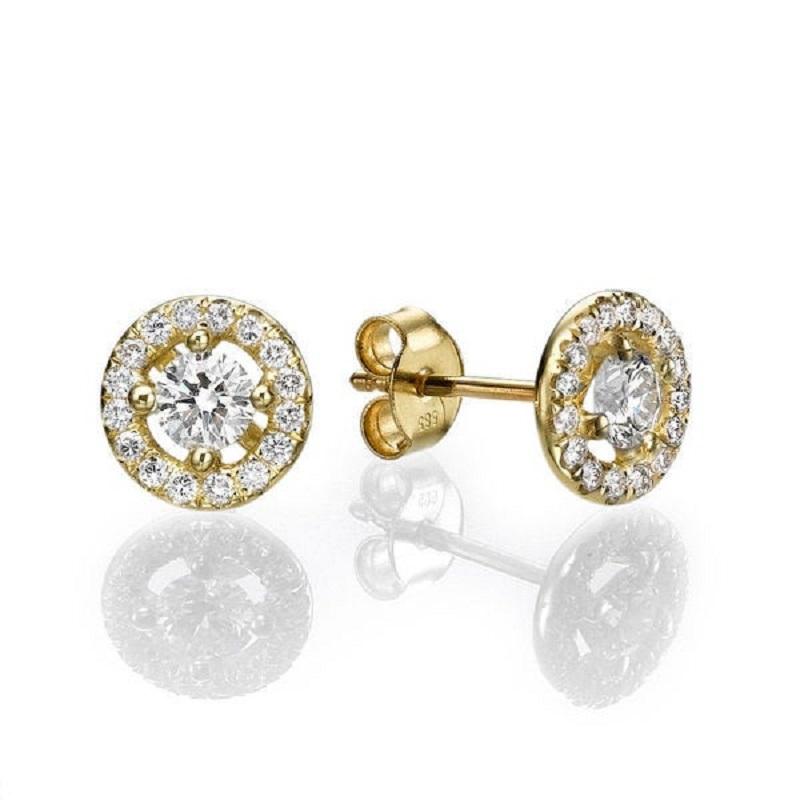 A beautiful Diamond stud earrings made of 14K Yellow Gold set with a pair of excellent Round cut Diamond of SI1 clarity and F color accented by 30 natural round diamonds. The total carat weight of these Diamond studs is 1.30 carat.
 
 
 Center