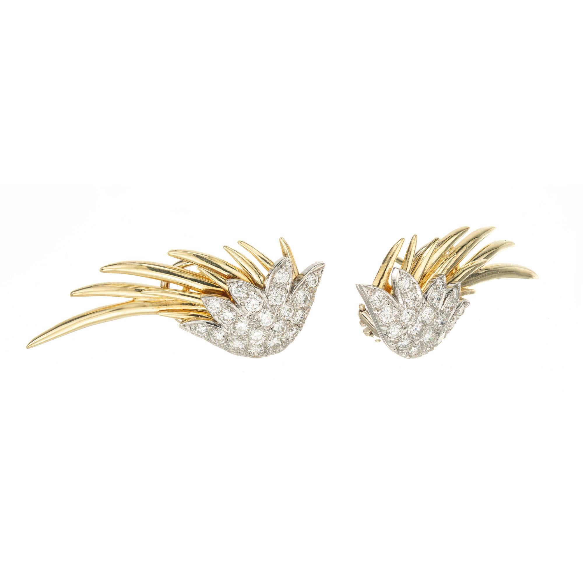 1970's Glittering and sophisticated, these 1.30ct diamond platinum and 18k yellow gold clip post wing earrings are true showstoppers. Crafted with precision, the combination of platinum and yellow gold creates a stunning contrast that enhances the