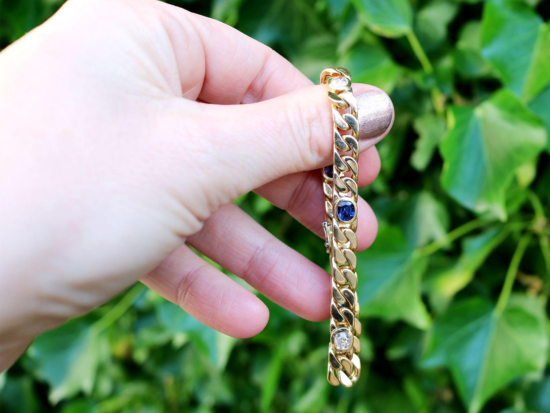 A stunning, fine and impressive 1.30 carat natural blue sapphire and 1.02 carat diamond, 18 karat yellow gold curb link bracelet; part of our diverse vintage jewelry and estate jewelry collections.

This stunning, fine and impressive sapphire and