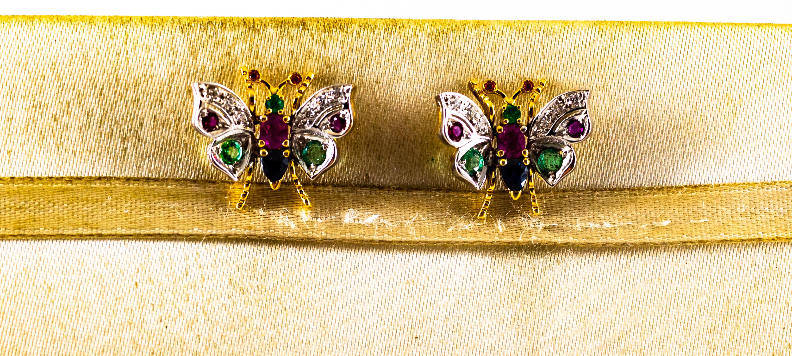 These Stud Earrings are made of 18K Yellow and White Gold.
These Earrings have 0.10 Carats of White Brilliant Cut Diamonds.
These Earrings have 0.30 Carats of Emeralds.
These Earrings have 0.60 Carats of Rubies.
These Earrings have 0.30 Carats of