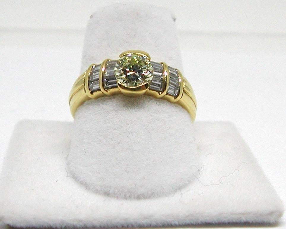 Gold: 18K Yellow Gold. 
Weight: 5.40 gr. 
Center Diamonds: 0.80ct. Fancy Yellow / VS
Accent Diamonds: 0.50ct. H / VS
Width: 0,7 cm 
Ring size: 53 / 17,00mm / 6,25 US
Free resizing of ring up to size 70 / 22mm / US 13
Shipping: free worldwide insured