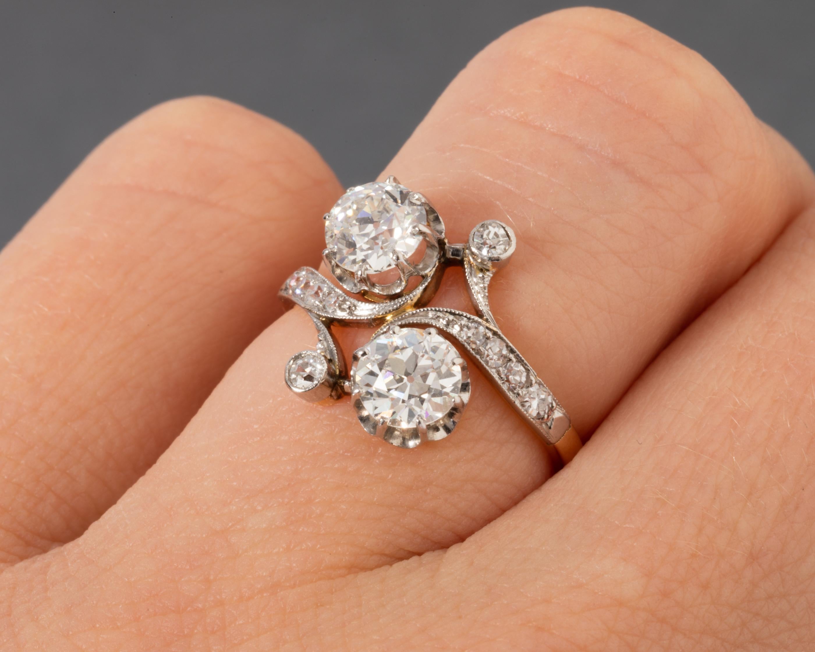 Very lovely ring, made in France circa 1900.
The two principal diamonds are very good quality old European cut diamonds. They weight 0.60 carats each approximately. They are very white G/H color and very clear, vs1 clarity estimate.
French hallmark