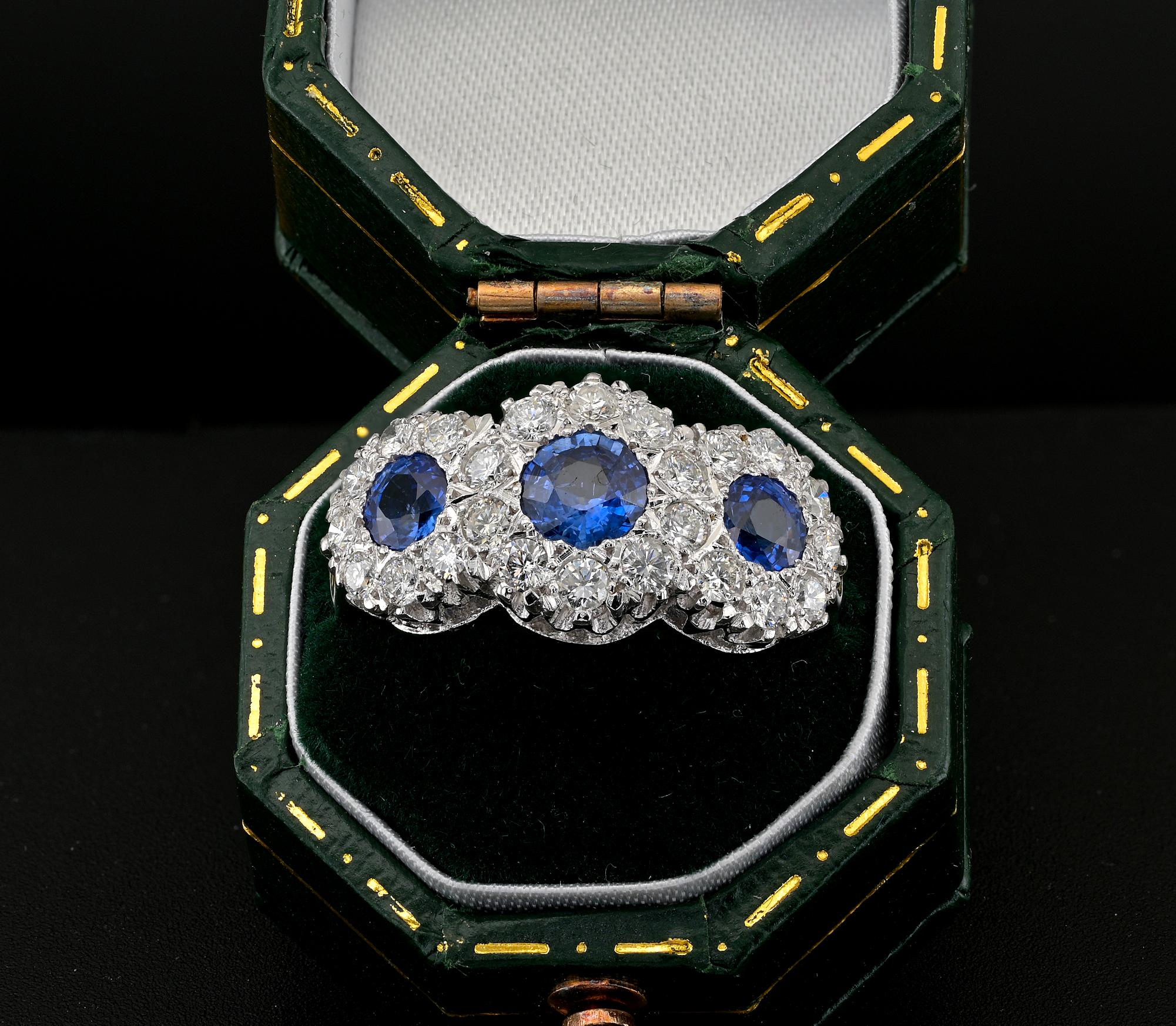 This very pretty Diamond & Sapphire ring is 1960 ca.
Hand fabricated mount of solid 18 Kt white gold
Gorgeously designed as a trio of clusters set with bright white Diamonds and intense cornflower colour Blue Sapphires
The centre piece is bigger
