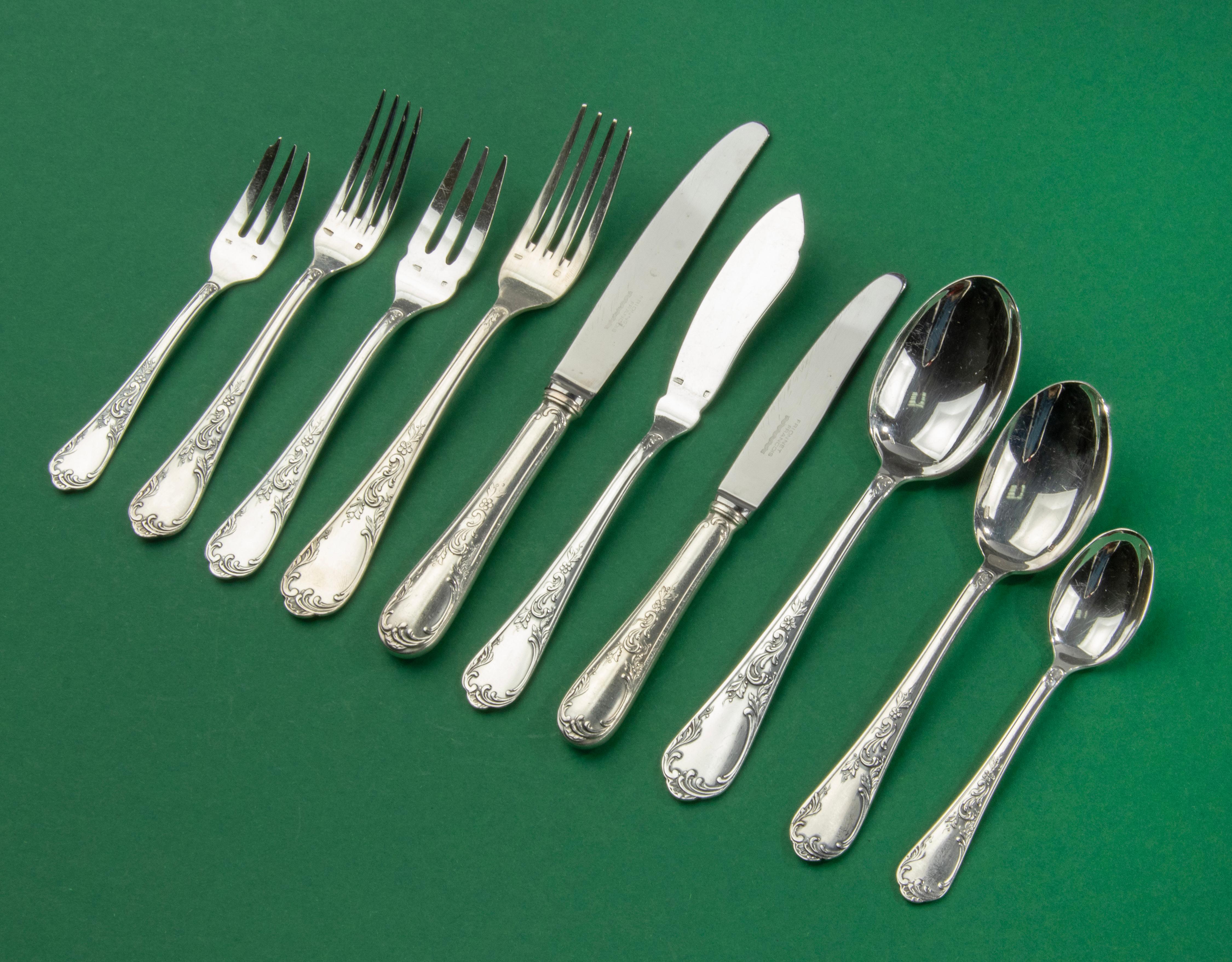 A lovely set of silver plated cutlery for 12 persons, made by the French brand Frionnet. 
An elegant design in rococo style, the cutlery dates from circa 1990 in is in very good condition. Beautiful colour and brilliance. 12 Table knives, 12 table