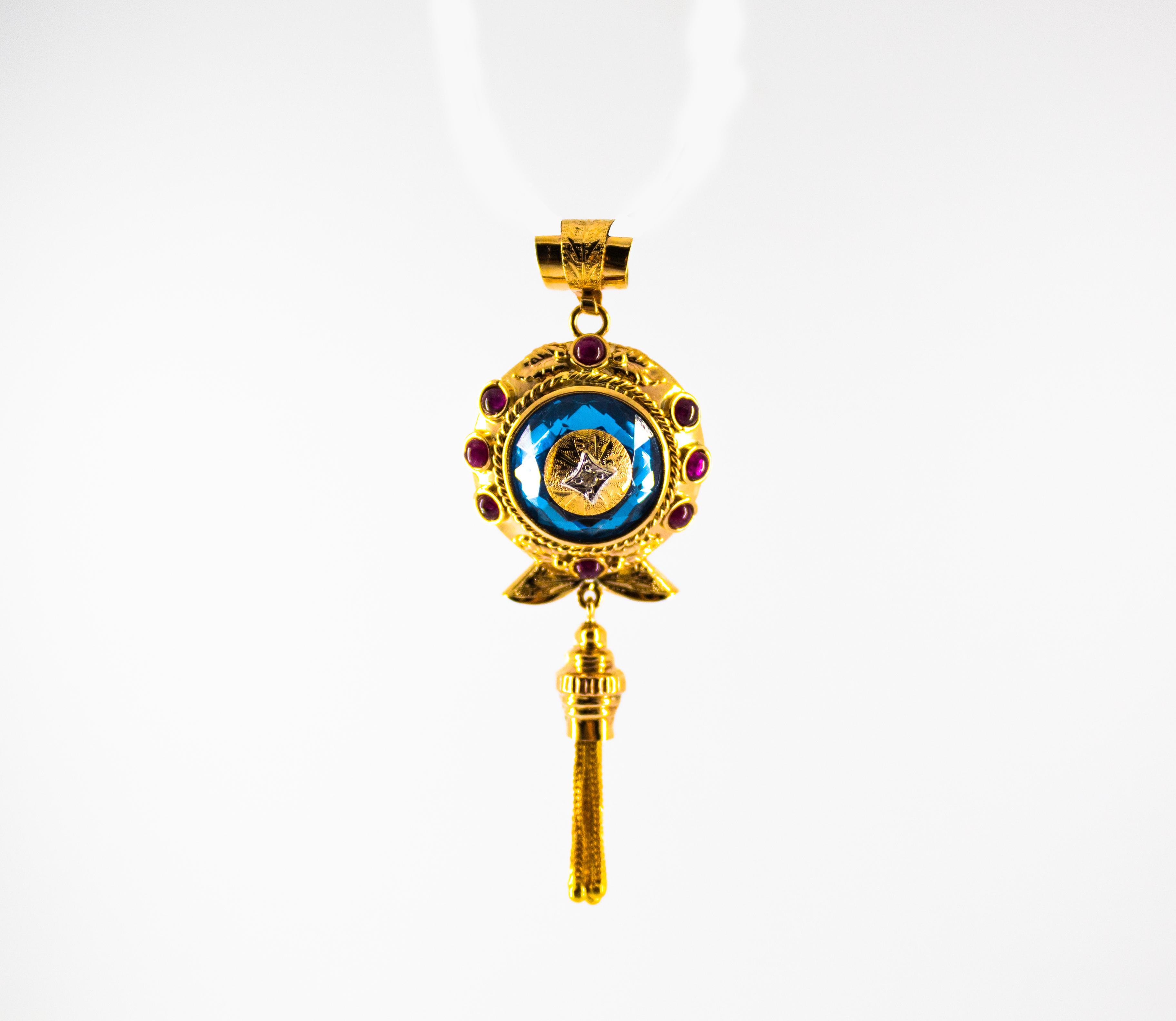 This Pendant is made of 9K Yellow Gold.
This Pendant has a 0.03 Carats White Diamond.
This Pendant has 1.80 Carats of Rubies.
This Pendant has a 13.00 Carats Blue Topaz.
We're a workshop so every piece is handmade, customizable and resizable.
