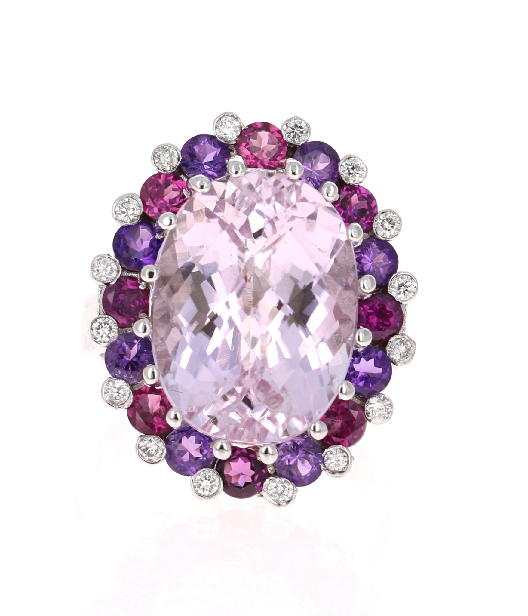 Super gorgeous and uniquely designed 13.00 Carat Kunzite, Amethyst, Purple Garnet and Diamond 14K Yellow Gold Cocktail Ring!

This ring has a large 10.85 carat Oval Cut Pinkish-Mauve Kunzite and is elegantly surrounded by alternating Round Cut