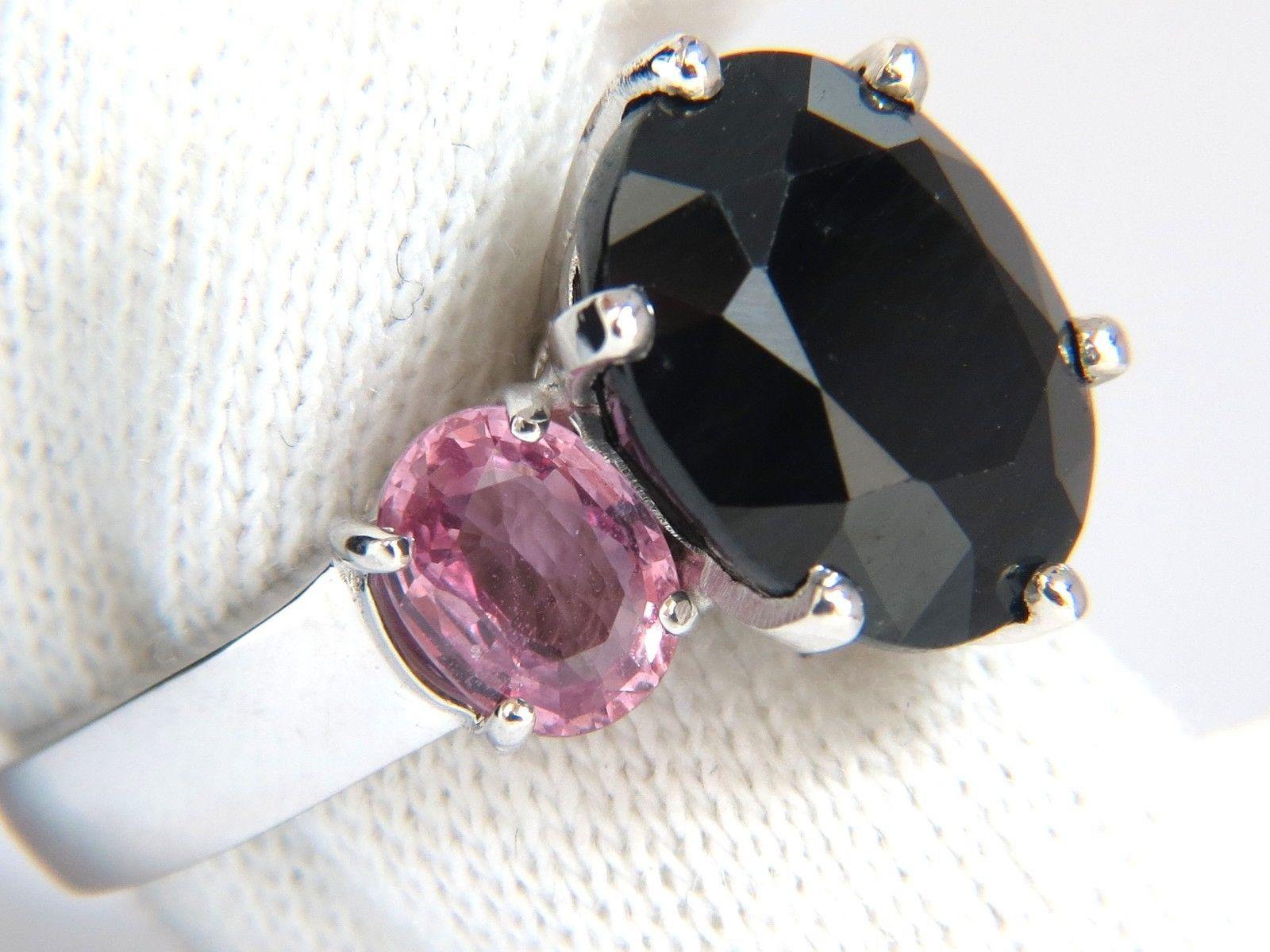 10.00ct. Natural Oval cut Black sapphire & 3.00ct. Pink sapphires ring.

Center Sapphire:

12.9 X 10.9mm



3.00ct side natural pink sapphires

Oval cut, transparent & Clean Clarity



14kt white gold.

8 grams.

Ring is: .57 Inch wide

Depth: .42