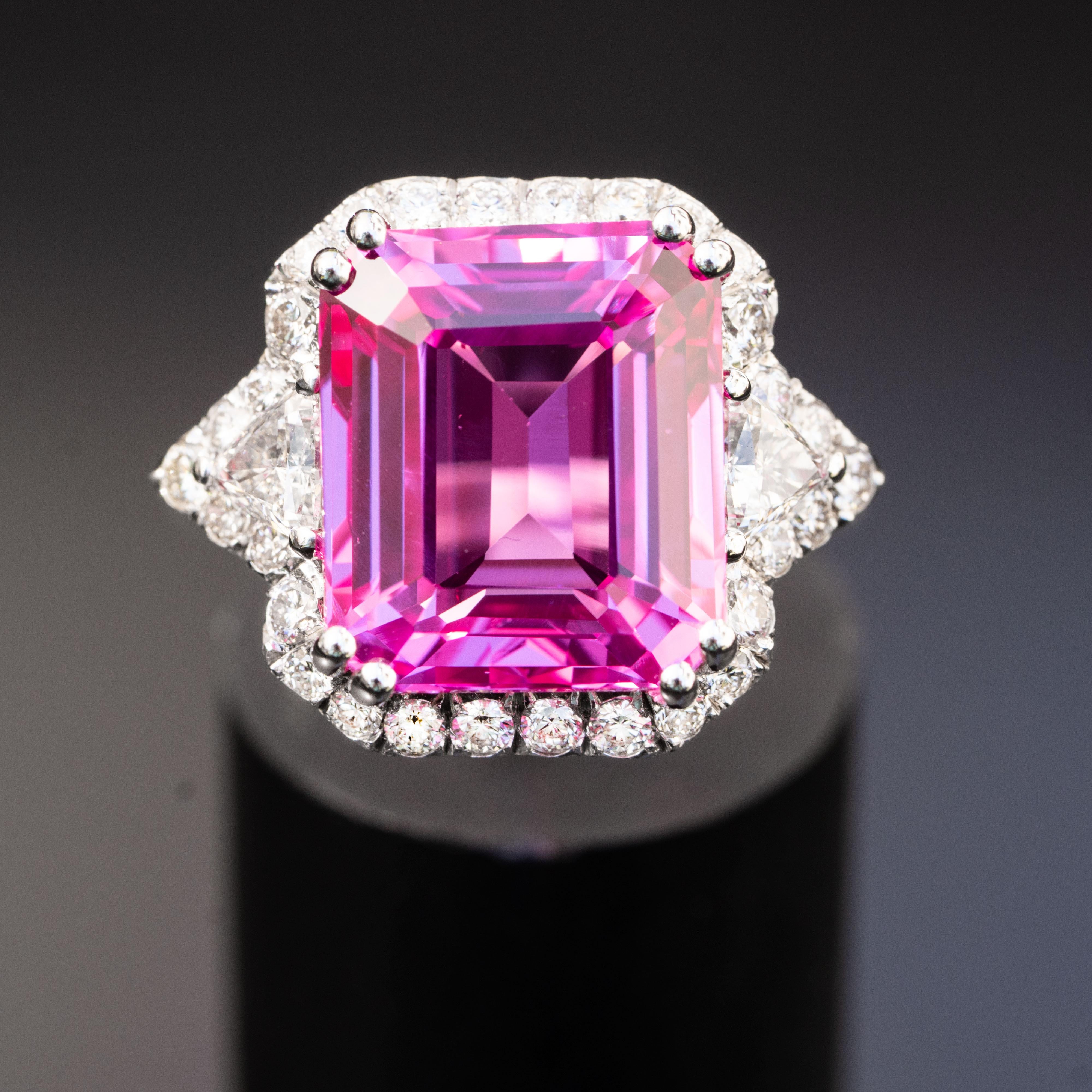 This gorgeous pink sapphire ring will impress everyone around you. It features a large emerald 13.00 carat gemstone, adorned with 1.20 carat natural diamonds.

Sapphire
Sapphire AAA+
Shape: Oval
Mineral: Corundum
Hardness: 9 on Moh's scale
Sapphire