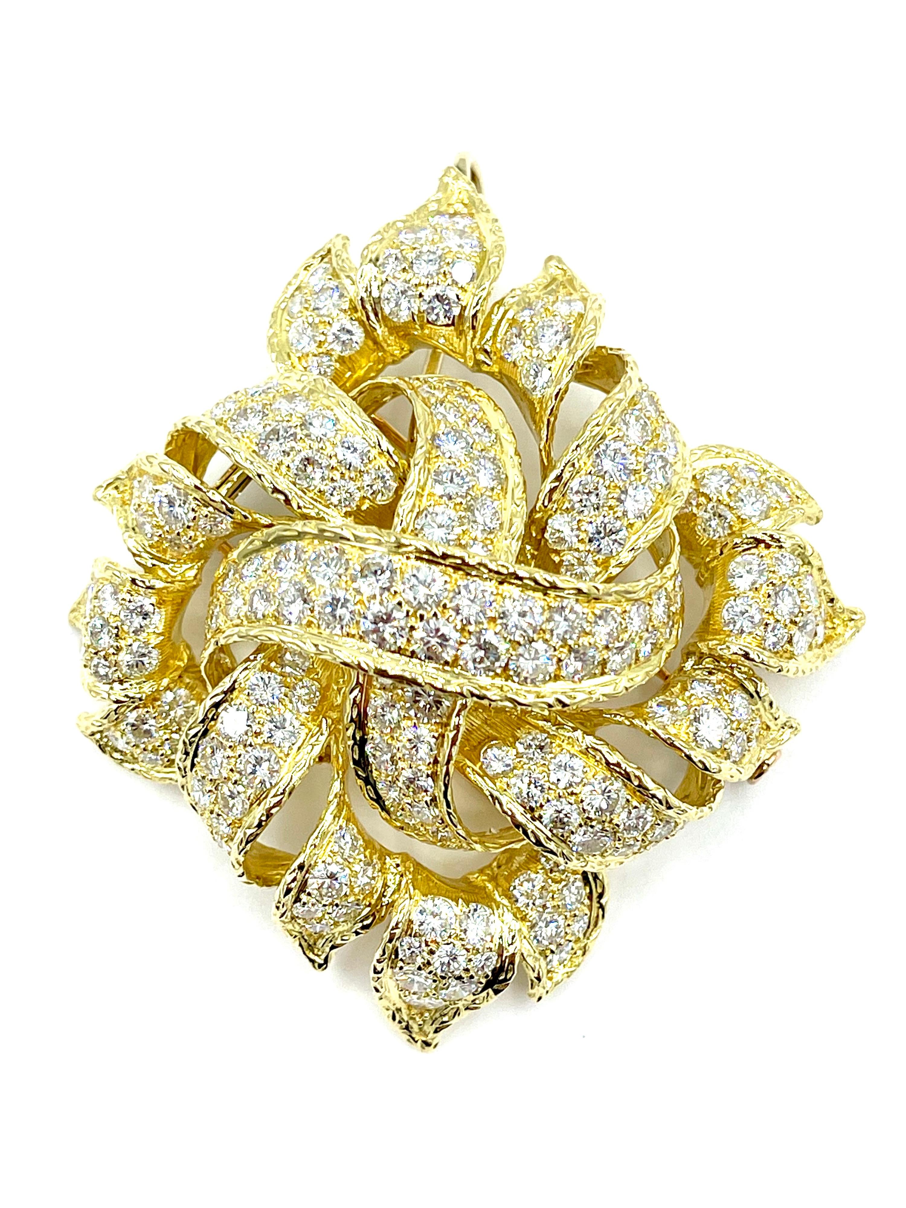 An amazingly vibrant French made ribbon pendant/brooch!  The 188 high quality round brilliant Diamonds combine for a weight of 13.00 carats.  The Diamonds are graded as E-F color, VS clarity.  The piece features a hidden bale to be worn as a pendant