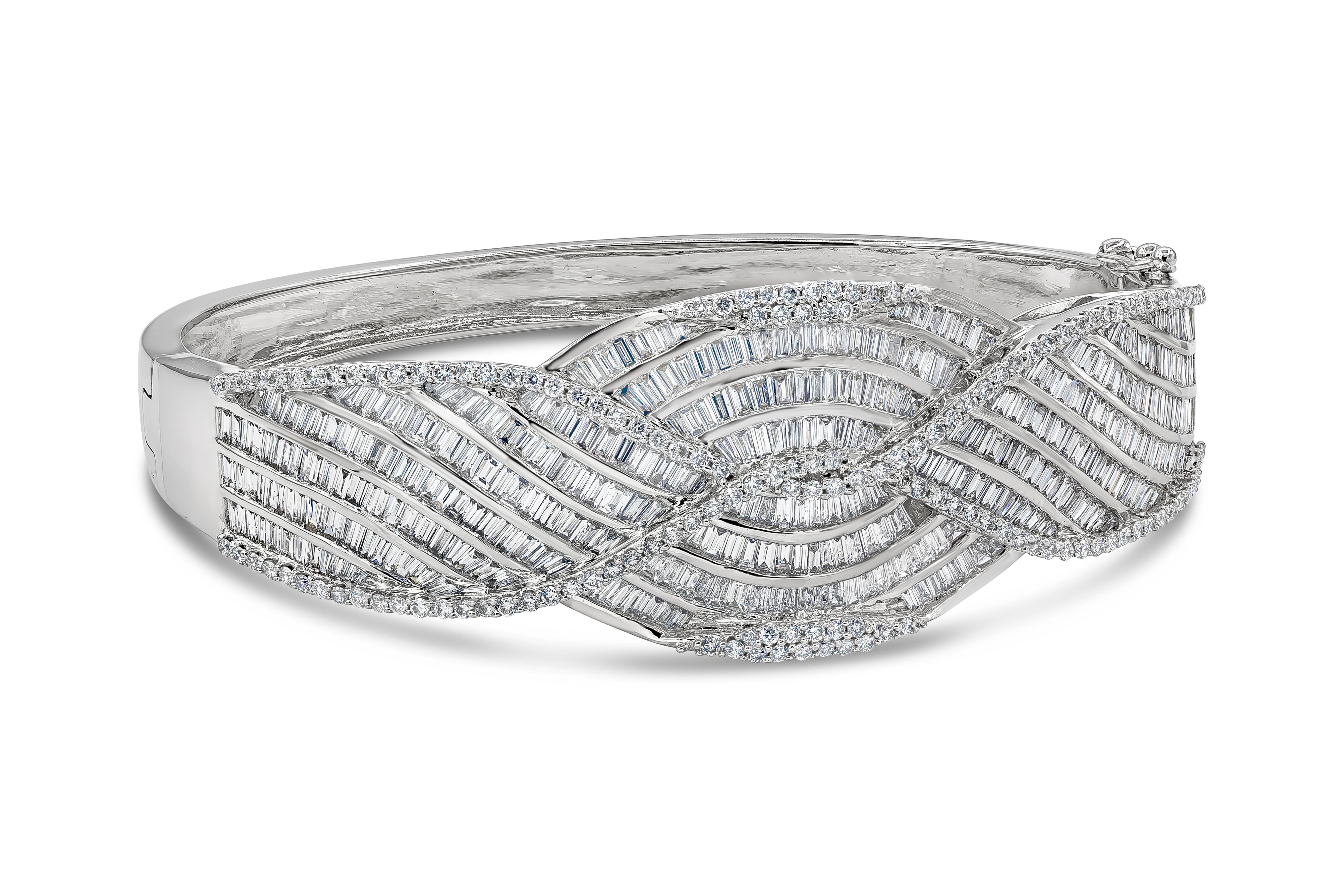 An exquisite and labor intensive design features a cluster of baguette diamonds weighing 11.58 carats total , set in an angled weave design, embellished with brilliant round diamonds weighing 1.45 carats total. Finely made in 18K White Gold. 

