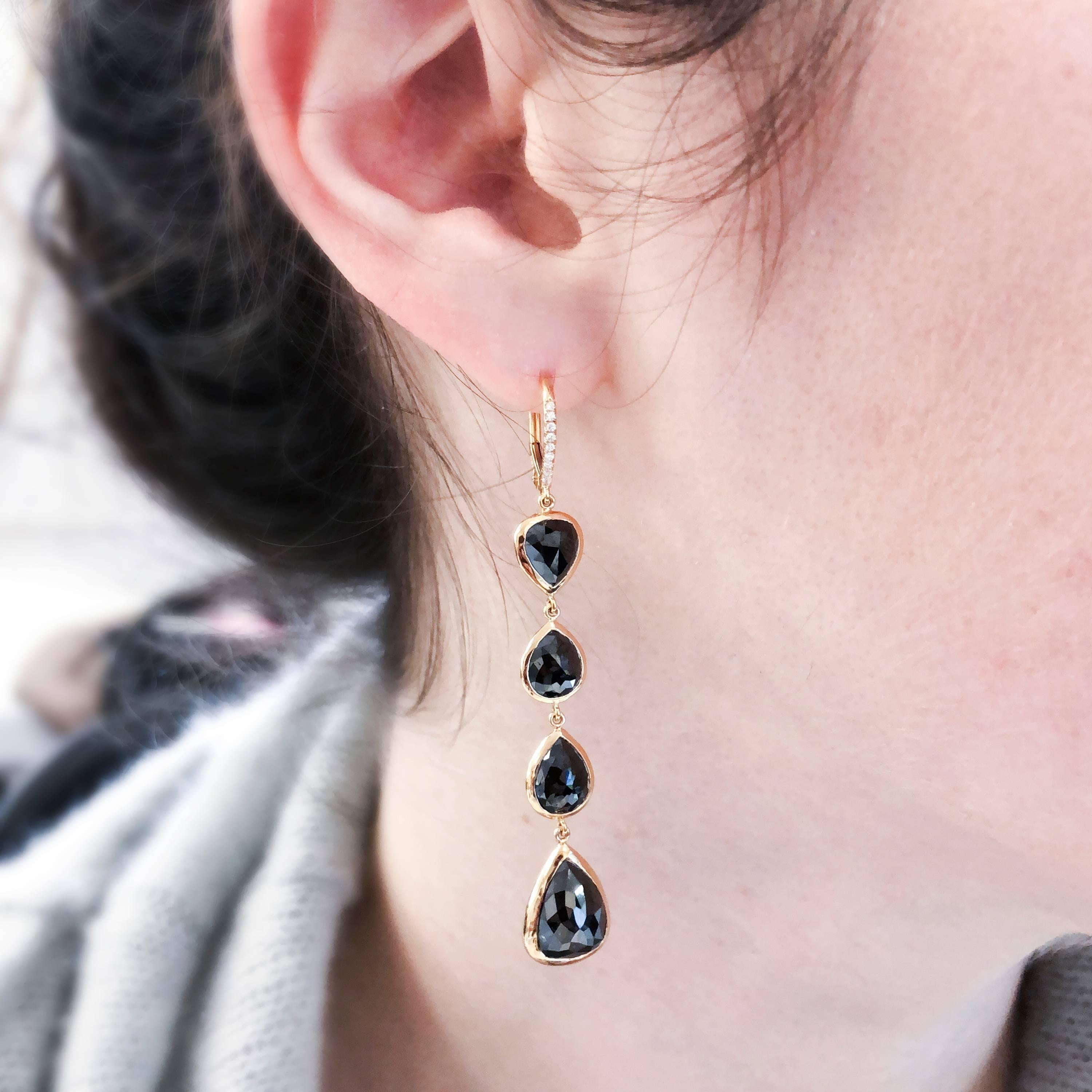 Bezel set diamond drop earrings 
13.04 ctw black diamond HPHT pearshapes (8 stones) 
Bezel wrapped in 18k rose gold, on leverbacks with 0.16 tw (18 stones) 