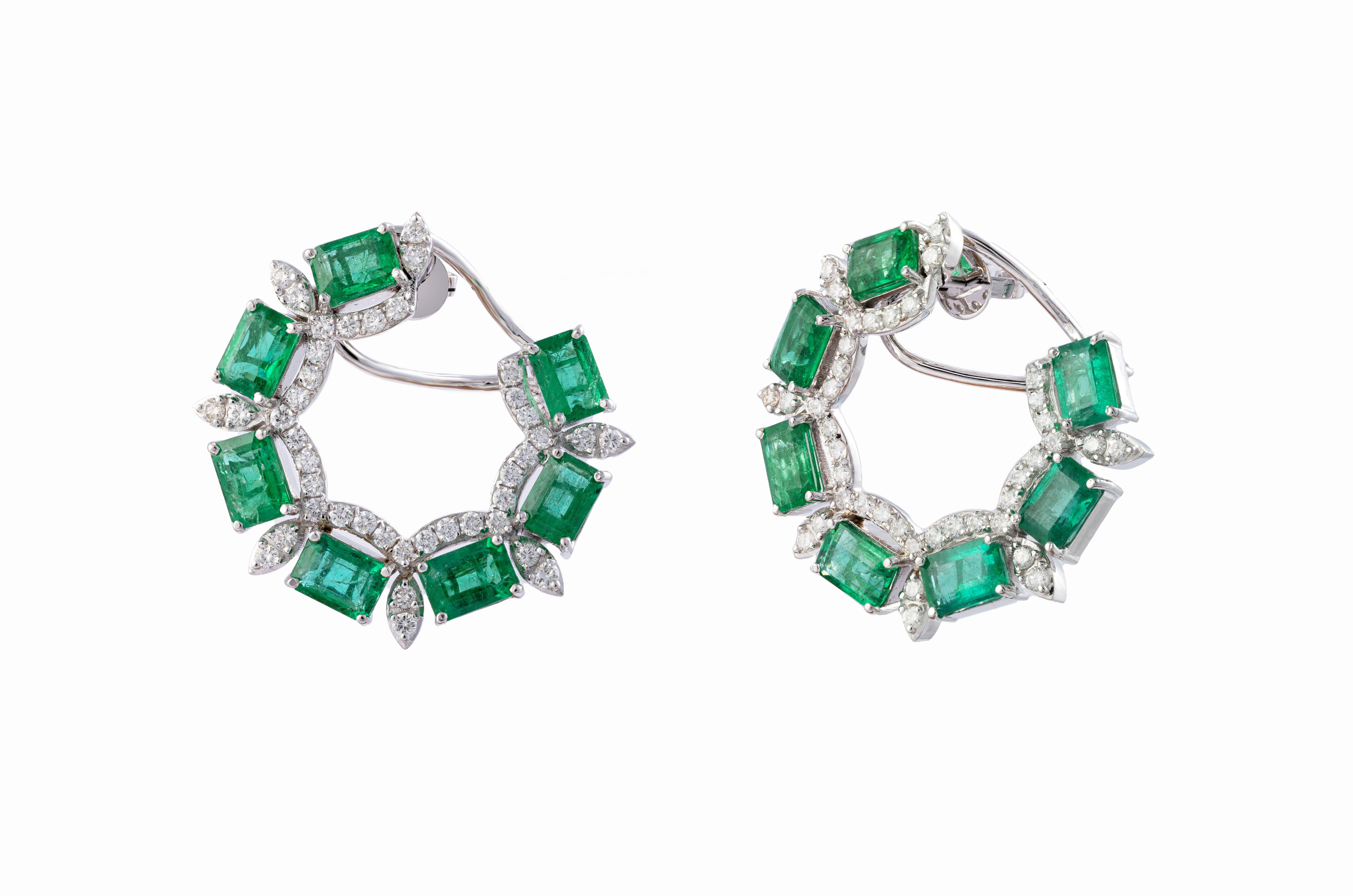This is a beautiful Zambian natural Emerald earring with diamonds and 14k gold. the Emeralds are of very high quality and diamonds also vsi and g colour. 

total emerald octogens : 13.04 cts
         diamonds : 2.25 cts
gold: 18.662gms