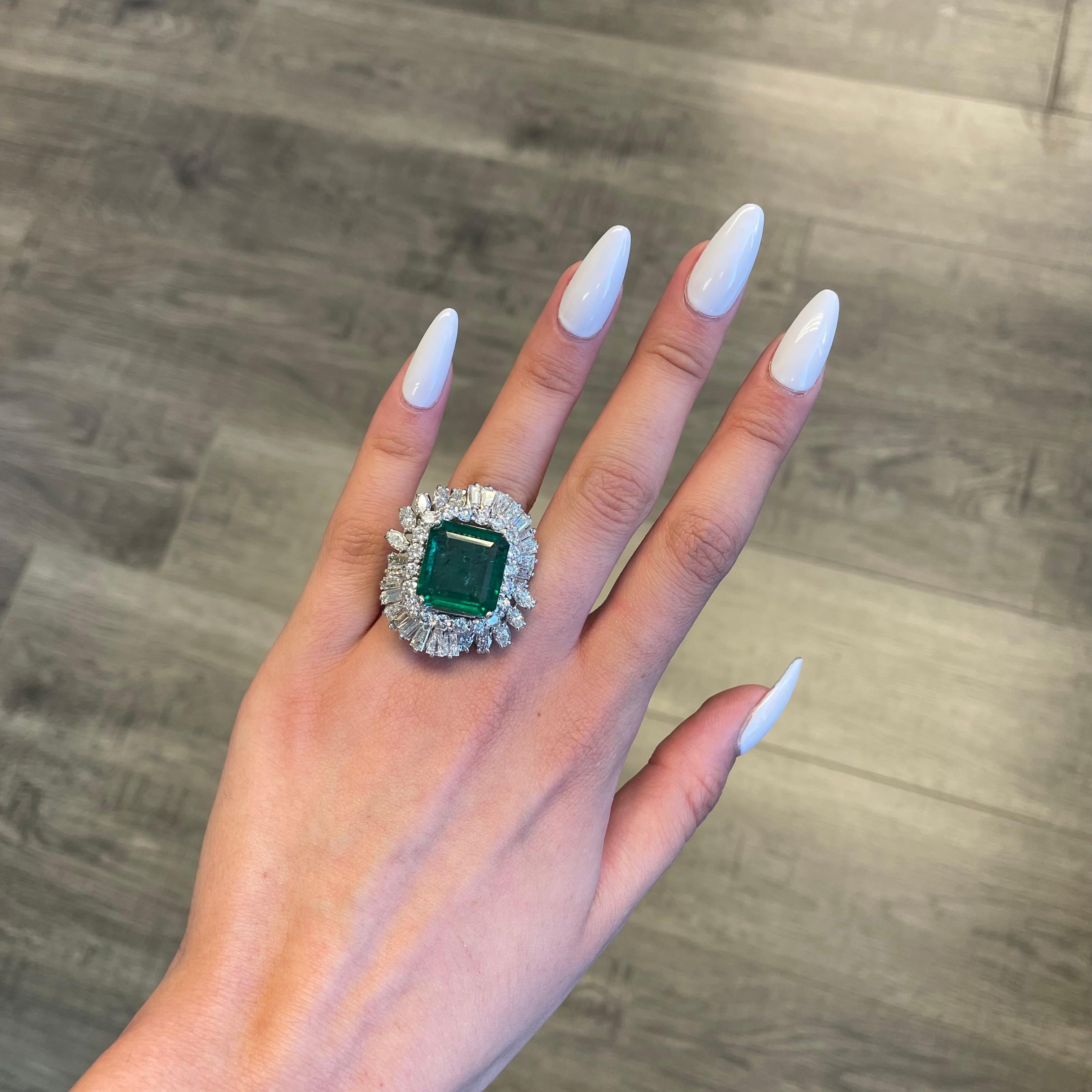Vintage emerald with diamonds high jewelry ring, circa 1970's.  
Approximately 21.97ct total gemstone weight. 
13.07ct Zambian emerald, F1 minor oil, GIA certified. Surrounded by apx 8.90ct of 20 round, 10 marquise, and 20 baguette diamonds. 18k