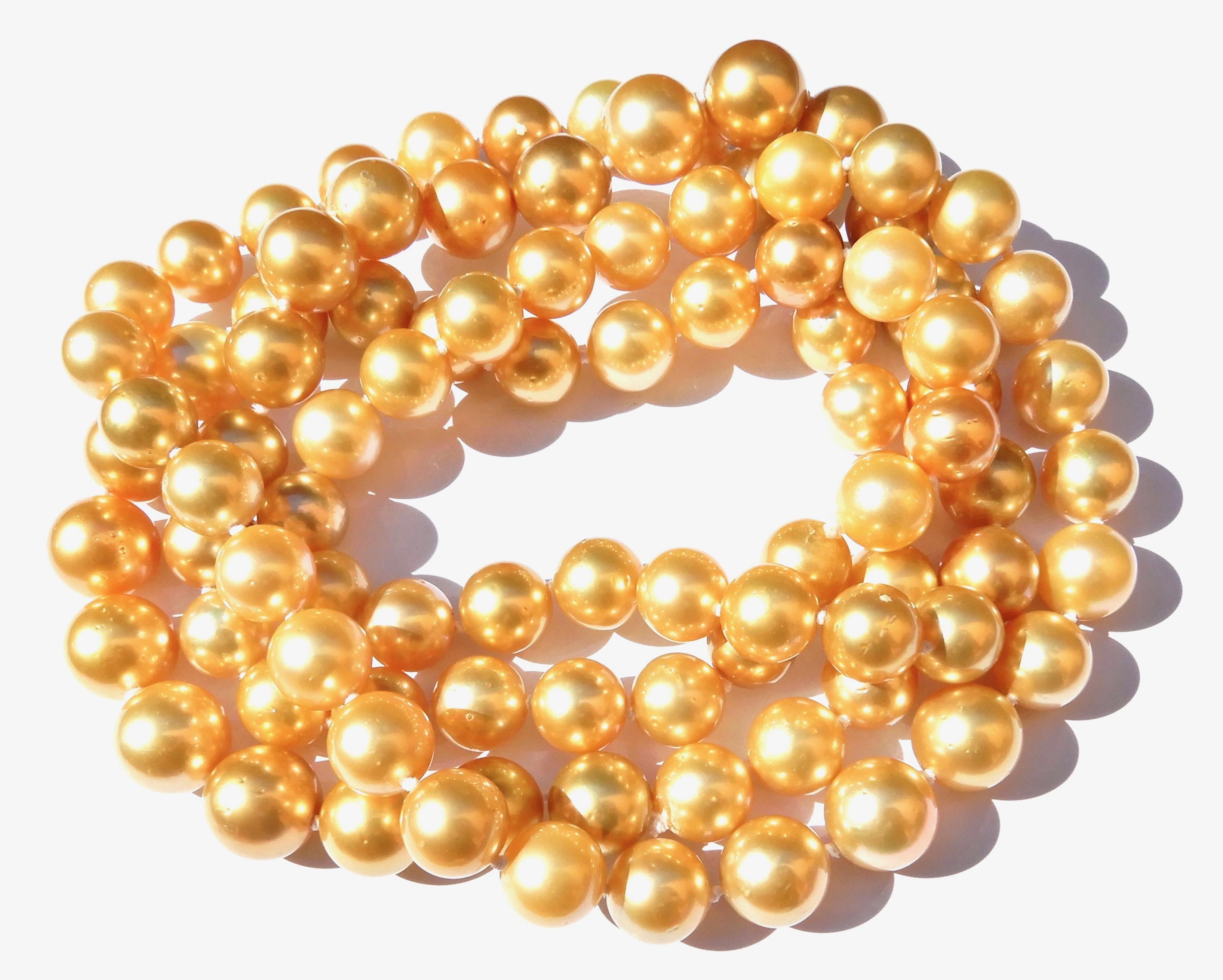 This amazing 130 CM Golden South Sea Pearl Rope Necklace is a wonderful Opera length, and dazzles when worn. 

Equivalent to three strands, and divine from every angle, this strand of 95 individually knotted golden south sea pearls a versatile