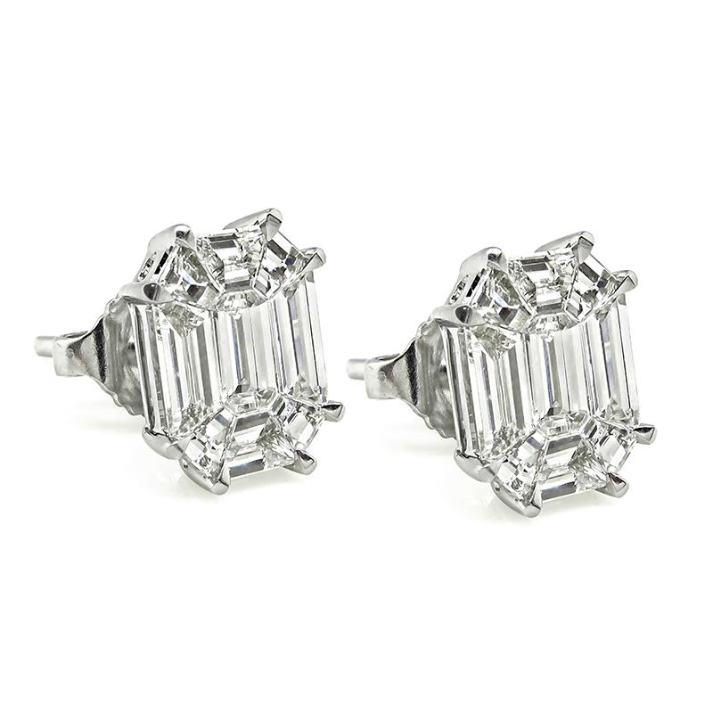 This is a gorgeous pair of 14k white gold diamond illusion set stud earrings. The earrings feature sparkling baguette, emerald and trapezoid cut diamonds that weigh approximately 1.30ct. The color of these diamonds is F with VS clarity. The earrings
