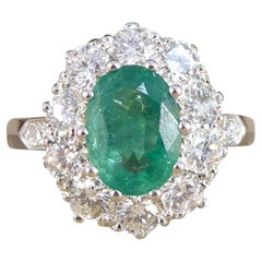 1.30ct Emerald and 0.90ct Diamond Cluster Ring in Platinum with Diamond Shoulder