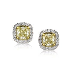 1.30ct Fancy Light Yellow Cushion Cut Diamond Halo Stud Earrings