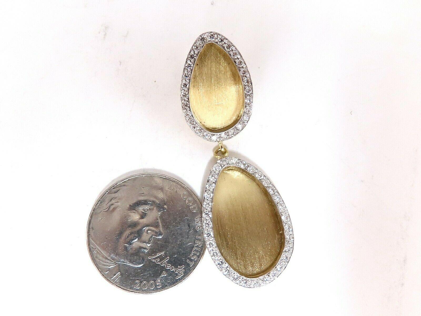 Brush Finished Tear Drop Dangle Earrings

1.30ct. Natural diamonds

Rounds, full brilliant cuts

Bead set, pave.

Vs-2 clarity.

F-G color. 

14kt. Yellow gold.

9.7 Grams.

Omega Clip Backs

Overall measurements:

1.75 inch long.

.61 inch wide at