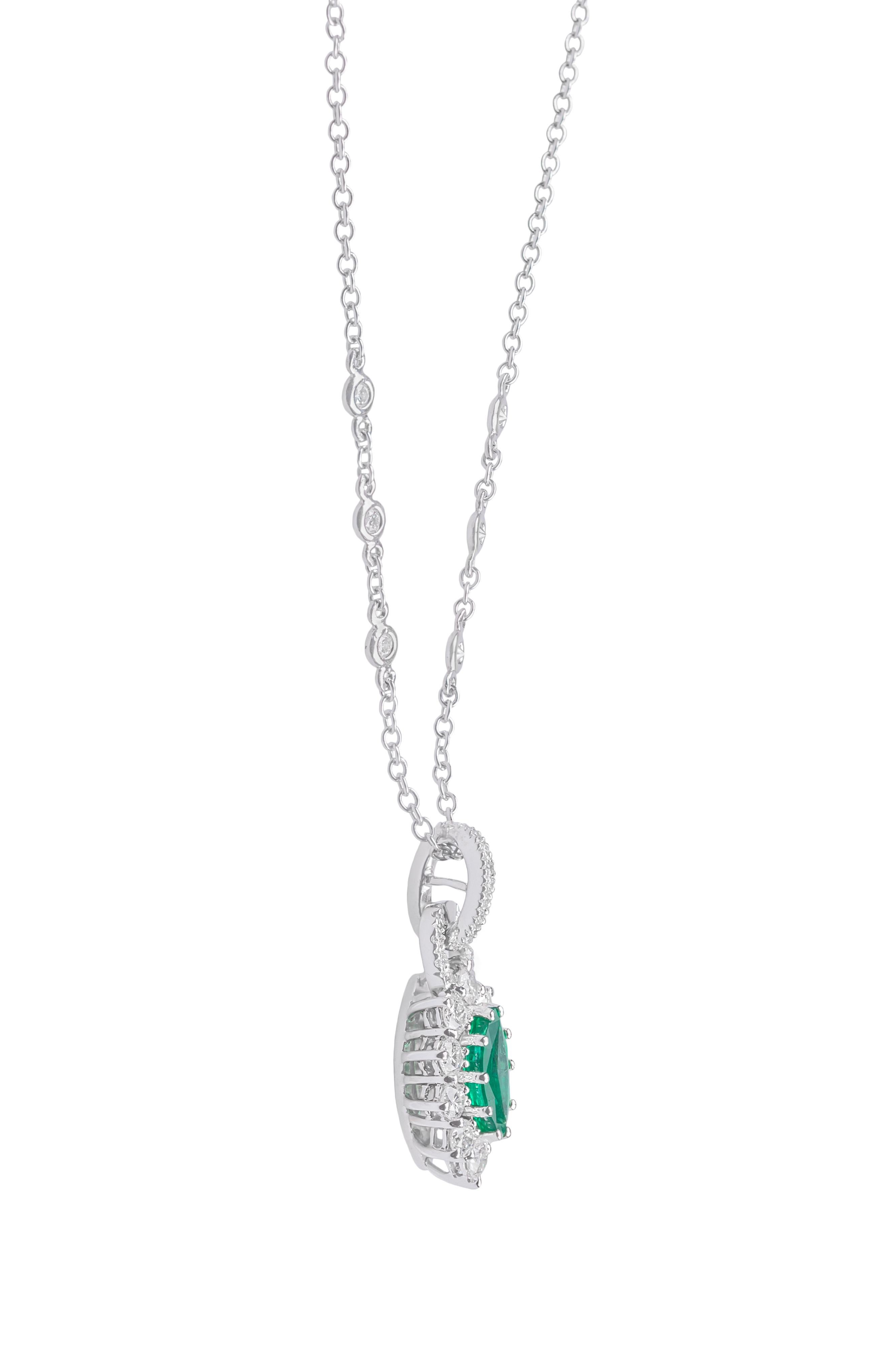 This stunning 18K white gold necklace is made in Italy by Fanuele dal 1905. It features 6 brilliant cut diamonds on the chain and a navette or marquise cut emerald surrounded by 10 brilliant cut diamonds.
Total emerald content is 1.30 ct
Total