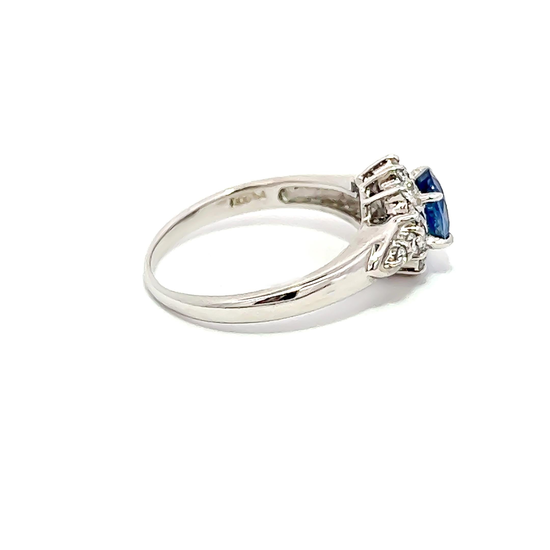 This exquisite ring showcases a magnificent 1.00CT blue sapphire perfectly complemented by 0.30CT round diamonds, all gracefully arranged in platinum. It is a truly timeless masterpiece that will surely become a cherished heirloom for generations to