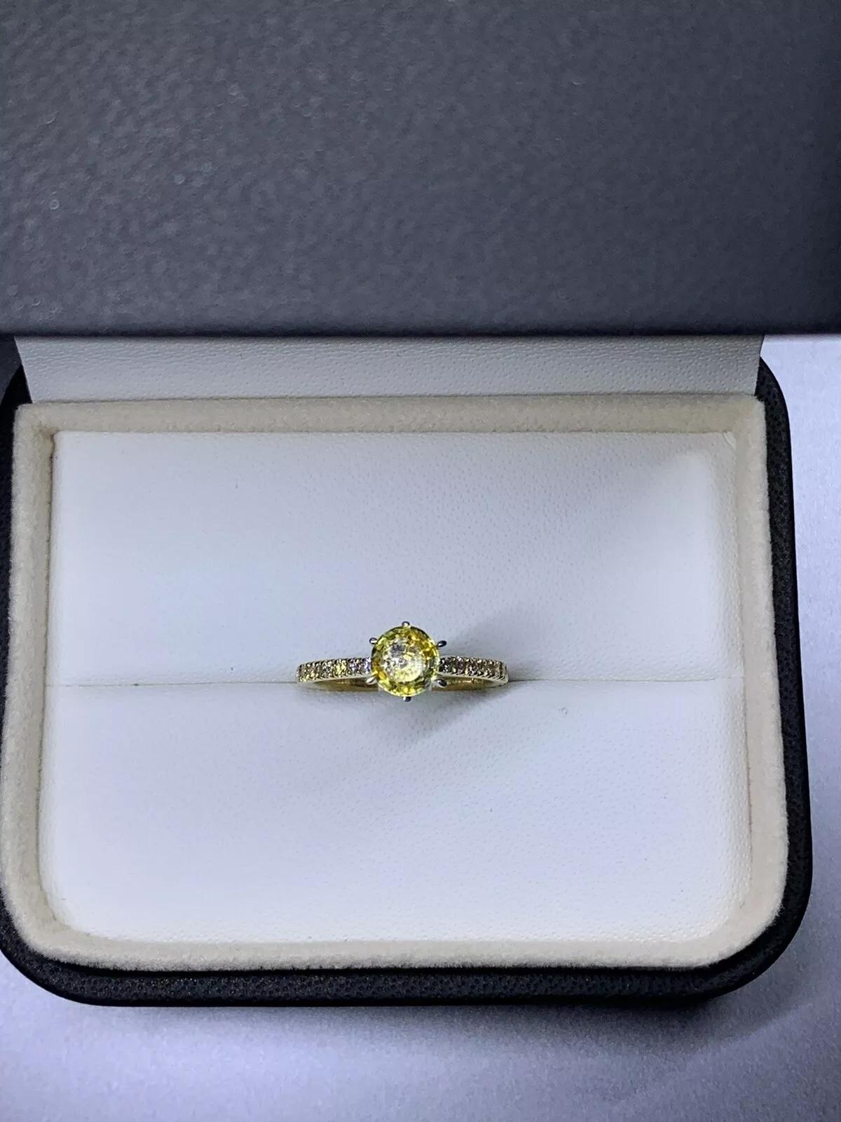 1.30ct Yellow sapphire diamond engagement ring 18k yellow gold.

Gorgeous yellow sapphire vivid colour chameleon round shaped natural untreated with diamond pave band in 18ct yellow gold and 18k white gold six claw setting.

Sapphire total weight