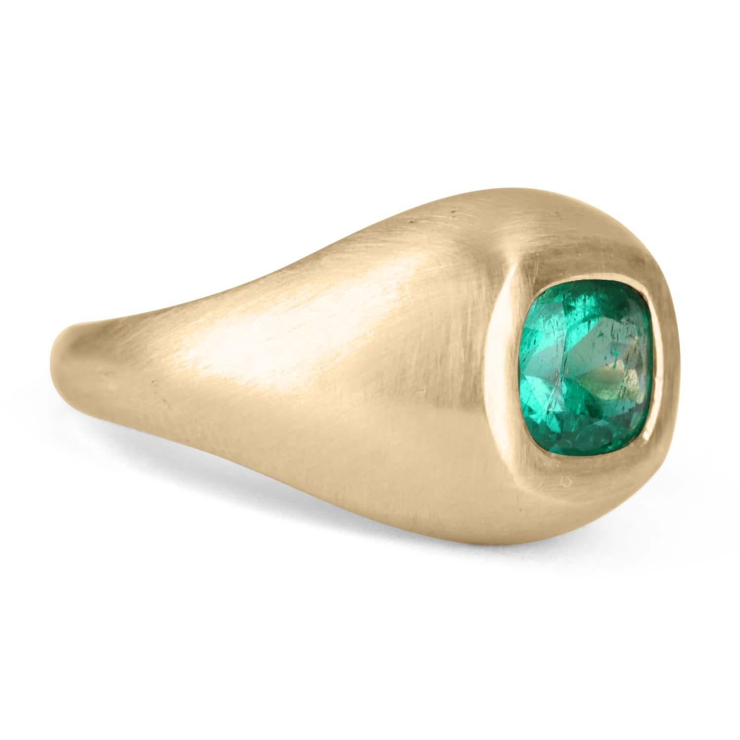 Displayed is a stunning, East to West, Colombian emerald gypsy ring in 14K yellow gold. This gorgeous solitaire ring carries a 1.30-carat emerald in a bezel setting. Fully faceted, this gemstone showcases very good shine and beautiful, green color.