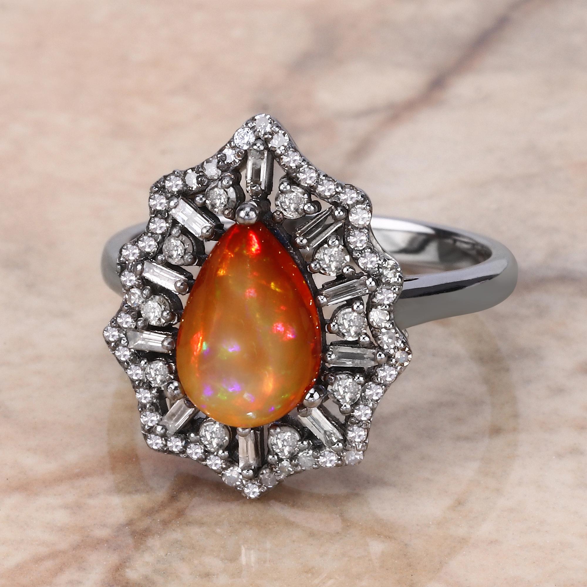 1.30cttw Ethiopian Opal with Diamonds 0.66cttw Sterling Silver Ring

Beautiful and elegant, our ring is a must-have for your jewelry collection. Intricately designed sterling silver beholds dazzling 1.30 ct. tw. pear-shaped rainbow opal cabachon