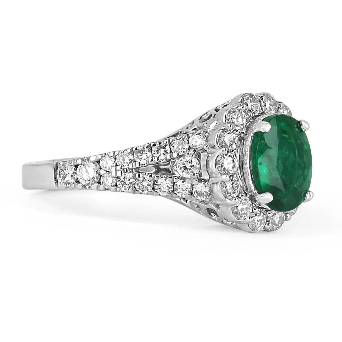 An exquisite oval emerald and diamond engagement/right-hand ring. The gorgeous setting lets sit a genuine, earth-mined, natural emerald with beautiful color and very-good eye clarity. The emerald is not perfect, and small imperfections do exist as
