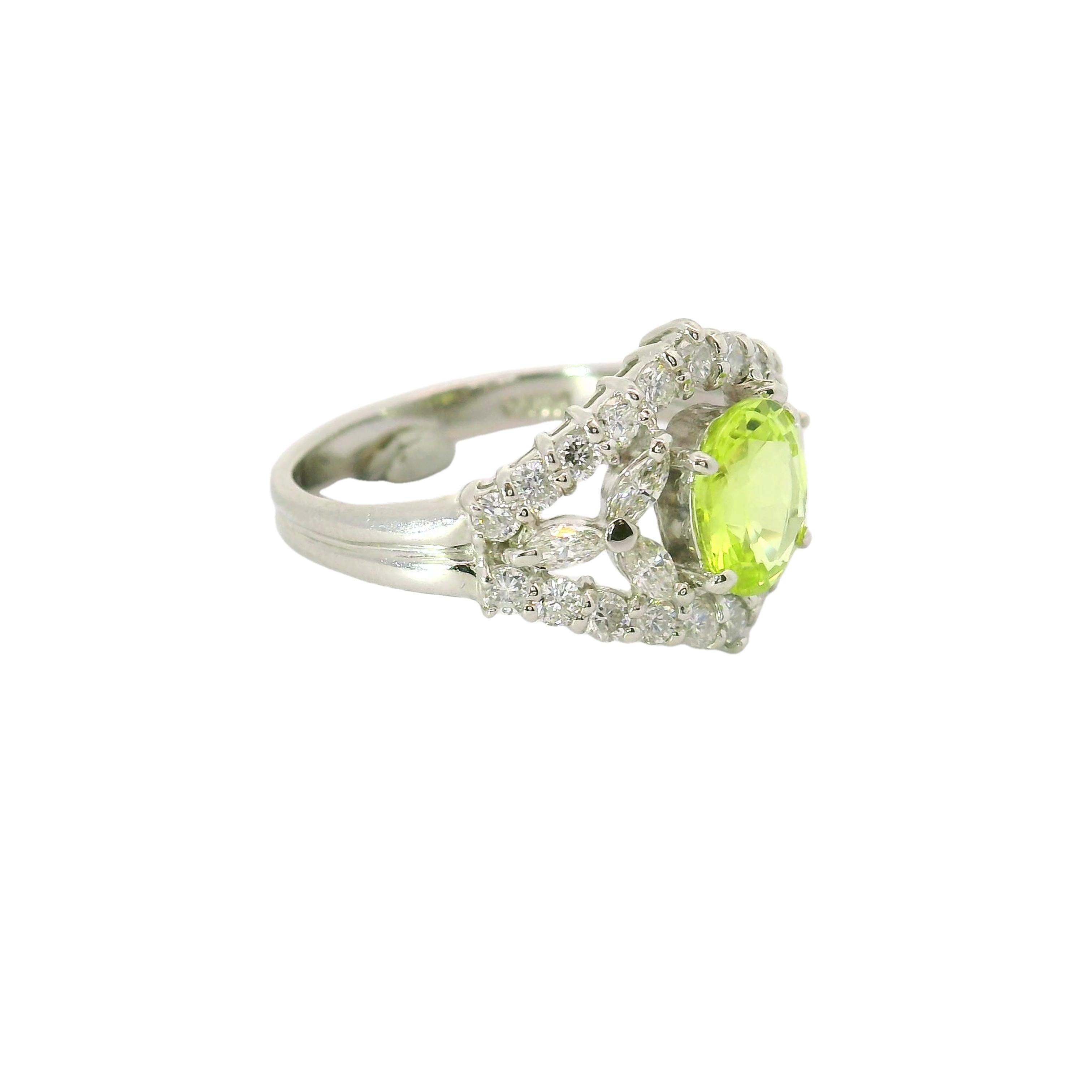 A striking chrysoberyl, weighing 1.31 carats, is the focal point of this contemporary ring. The chrysoberyl, cut in a refined oval shape, exhibits a vivid green hue that appears to glow in the light. Encircling the central stone are mixed-cut