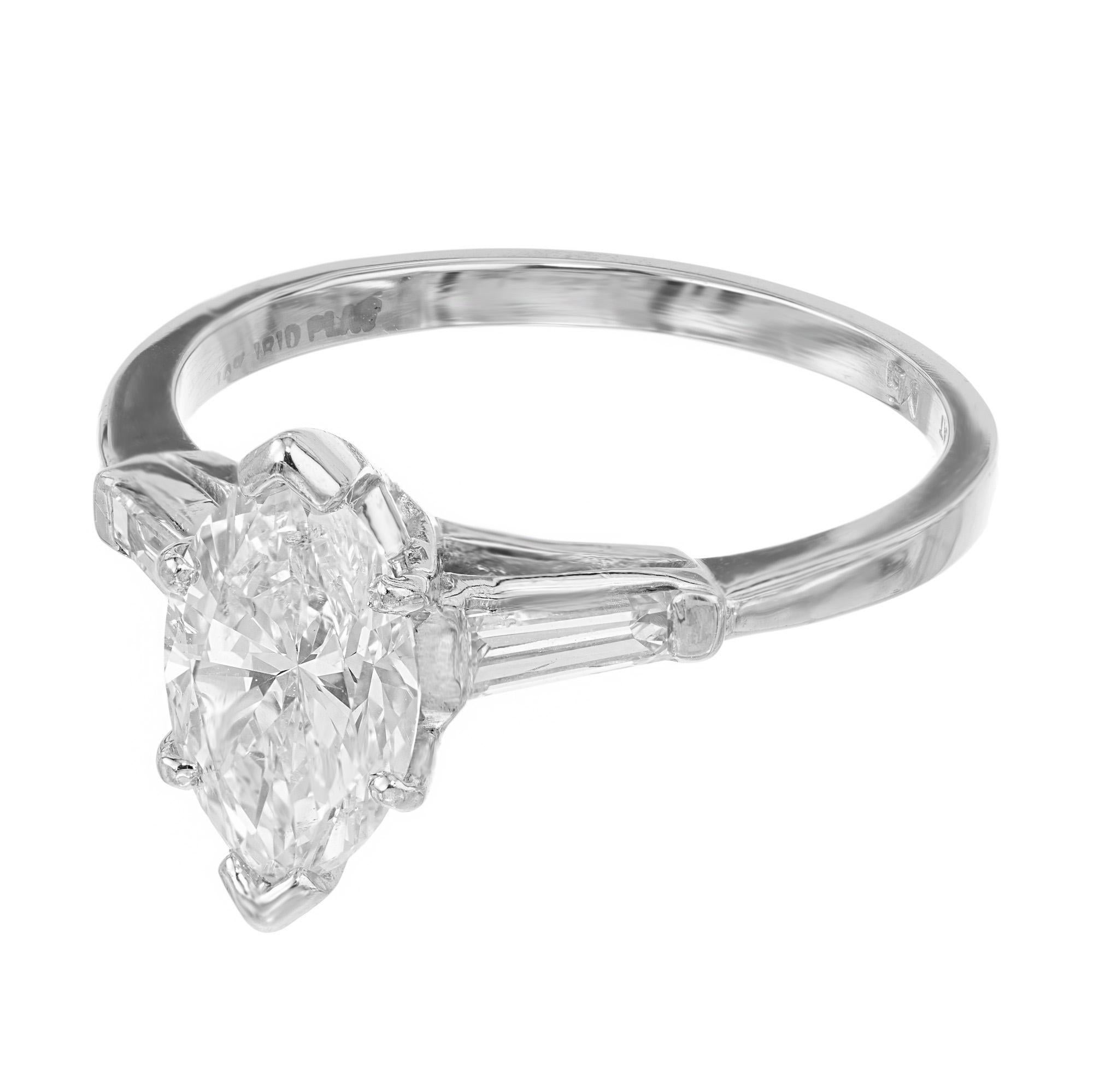 Discover the timelessness of 1960's elegance with our 1.31ct Diamond marquise and baguette platinum engagement ring, where classic design meets modern sophistication. The centerpiece, a stunning marquise diamond that radiates brilliance and captures