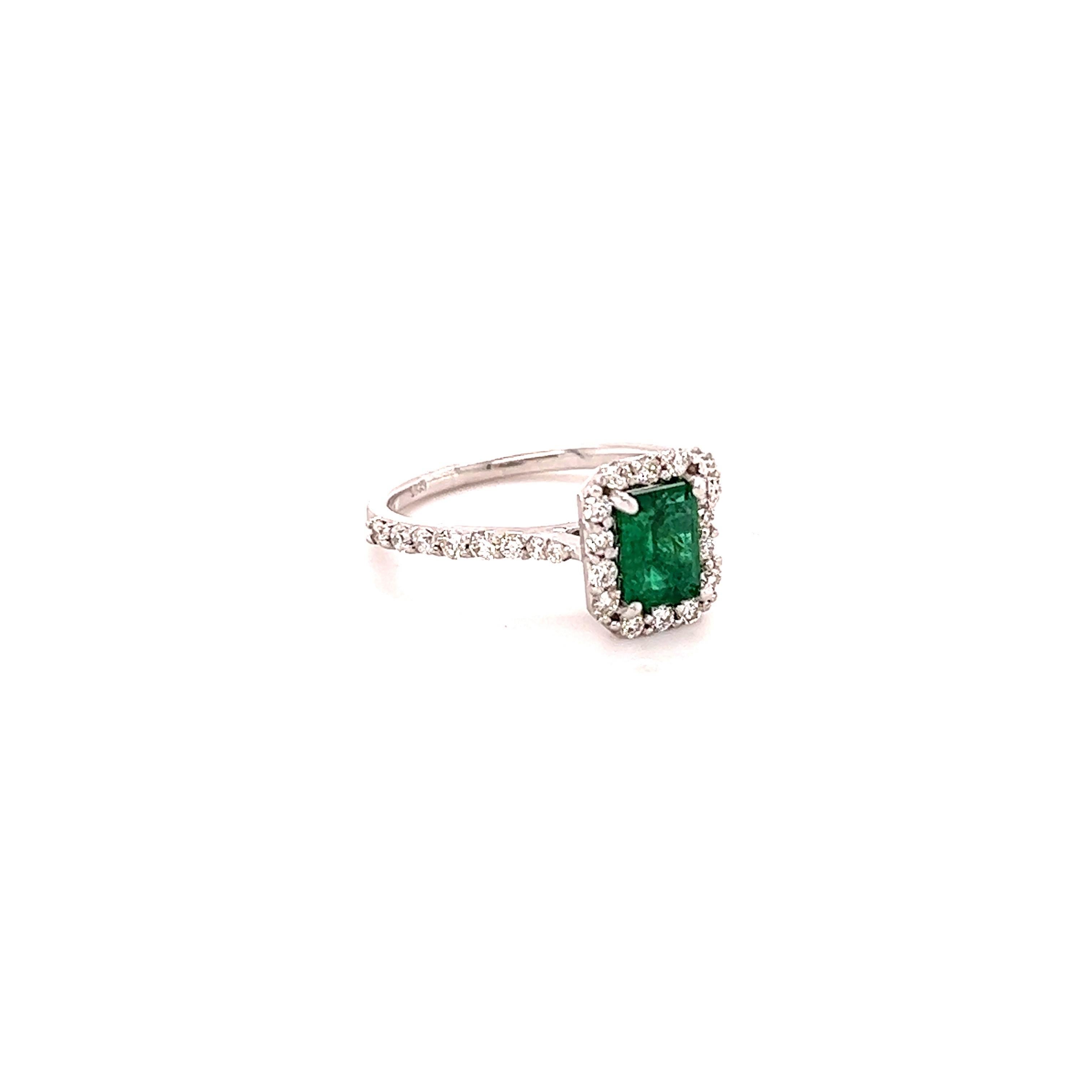 A beautiful & classic setting holding a Natural Emerald that weighs 0.76 carats. Surrounded by 30 Round Cut Diamonds that weigh 0.55 carats with a clarity & color of VS-H.  The total carat weight of the ring is 1.31 carats.

The Emerald Cut Emerald