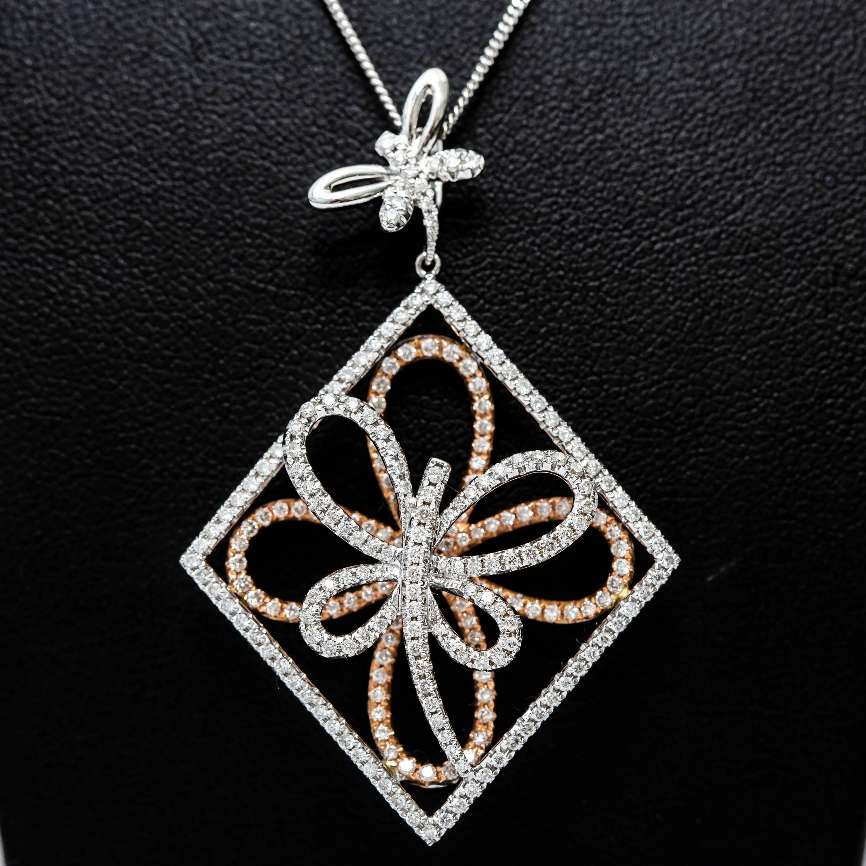 1.31 Carat Round White Diamond Color H Clarity SI1 Fancy Butterfly shaped pendant that hangs on a delicate chain. A uniquely feminine piece set in 18 Karat Rose and White Gold, British Hallmarked.
