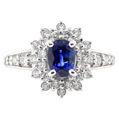 1.31 Carat Natural Sapphire and Diamond Halo Ring Set in Platinum