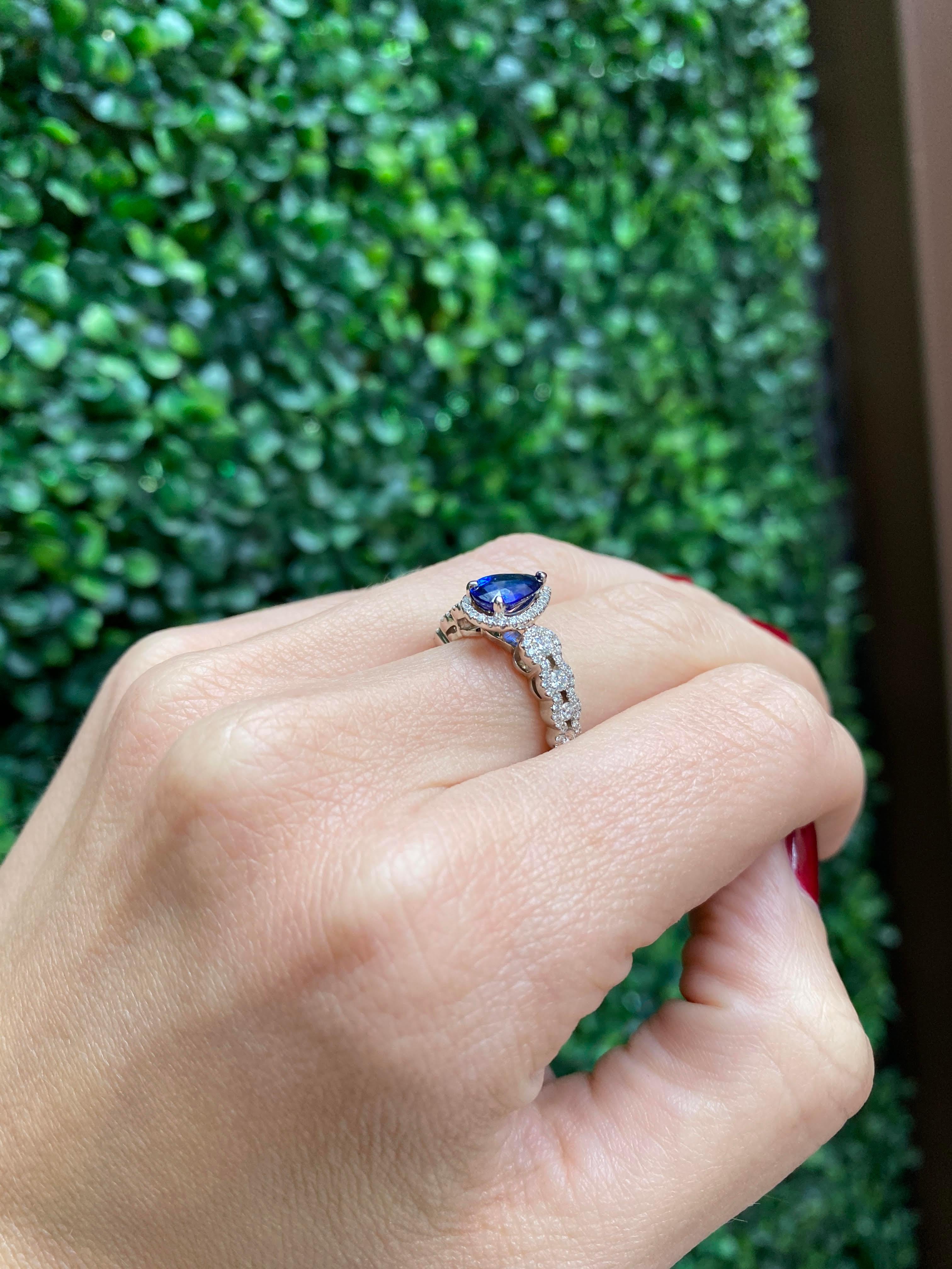 Women's or Men's 1.31 Carat Pear Shape Blue Sapphire Cocktail Ring with Diamond Halo For Sale