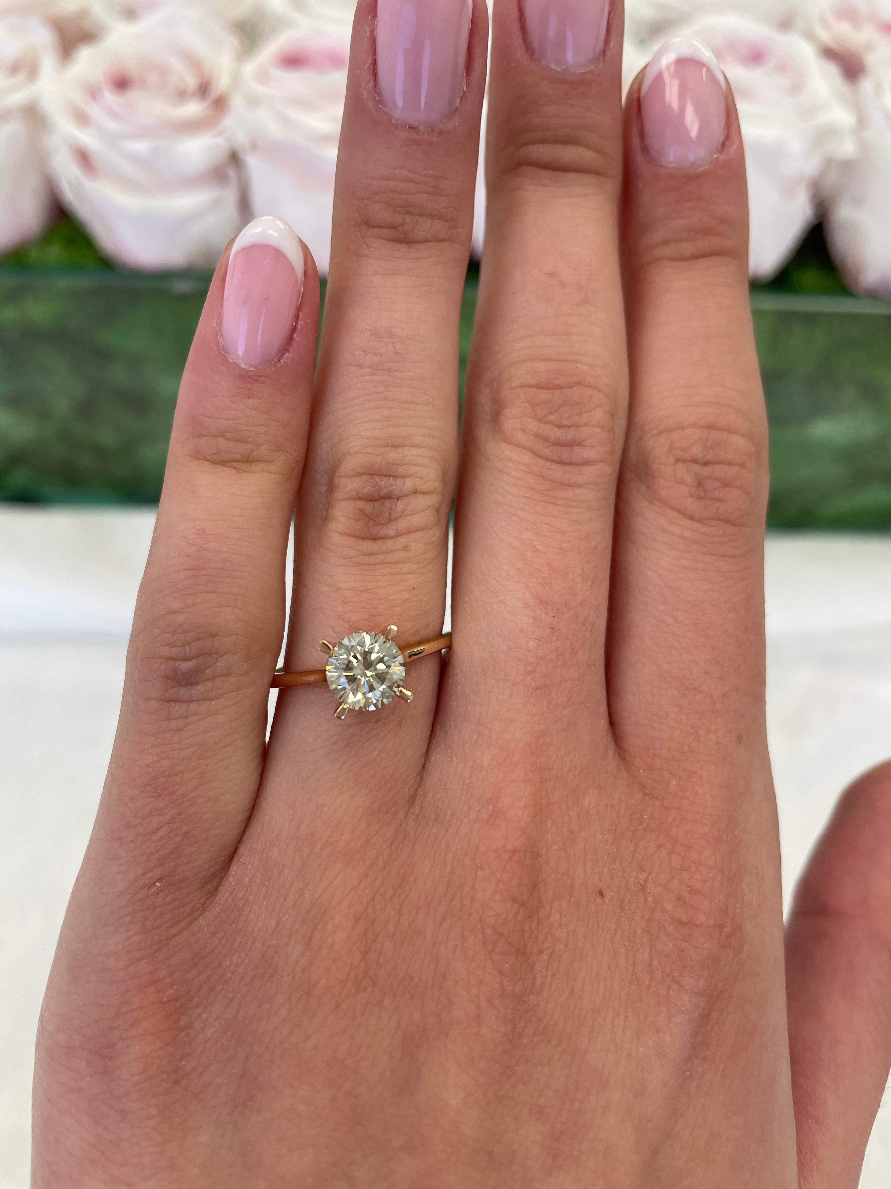 Classic solitaire diamond engagement ring with hidden halo.
1.40 carats total diamond weight.
1.31 carat round brilliant diamond, approximately L/M color grade and SI clarity grade. Complimented by 0.09 carats of round brilliant diamonds,