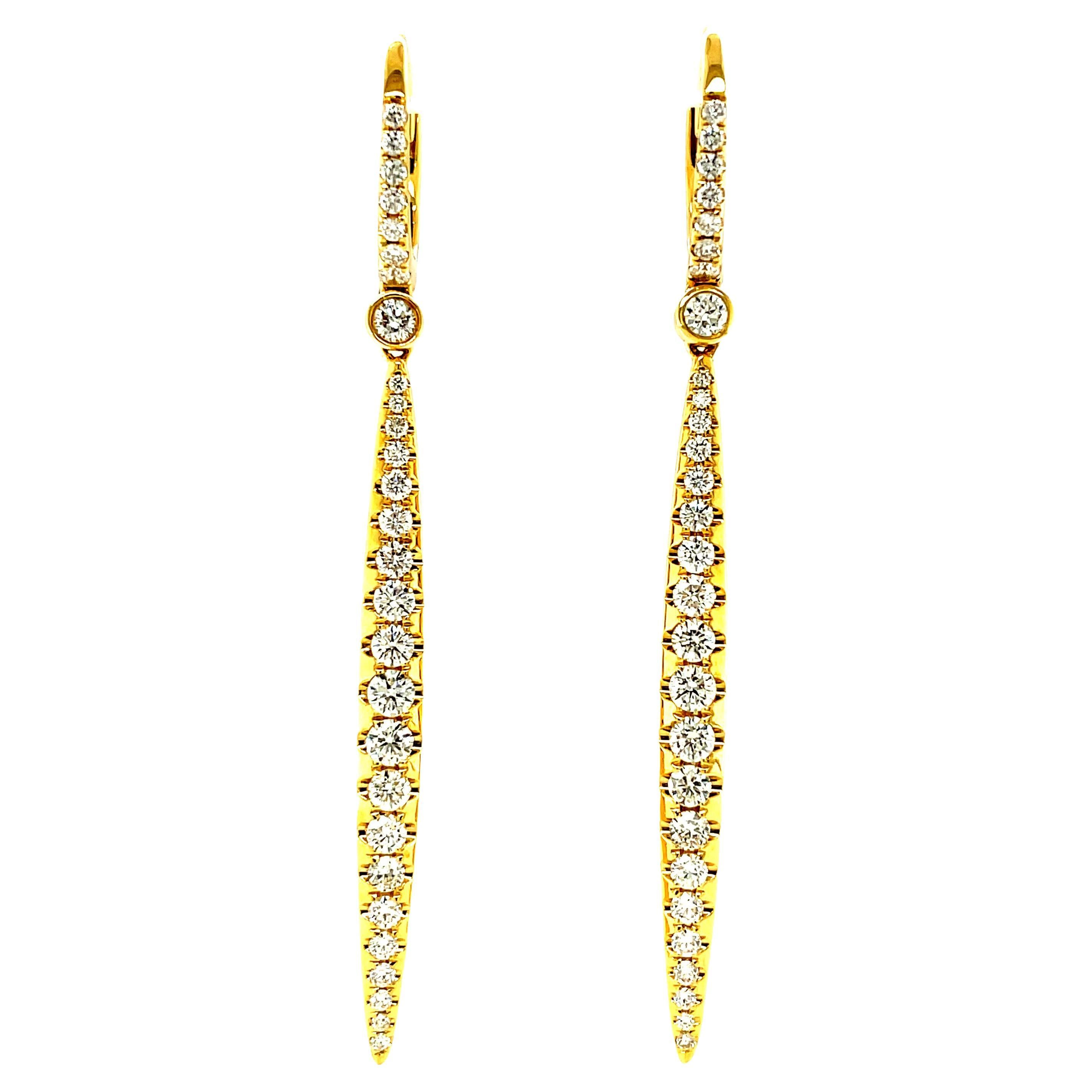 These gorgeous 18k yellow gold and diamond pave dangling earrings feature 1.31 carats of sparkling round brilliant cut diamonds! The elongated, linear design is so flattering and chic, they'll bring streamlined elegance and style to any outfit!