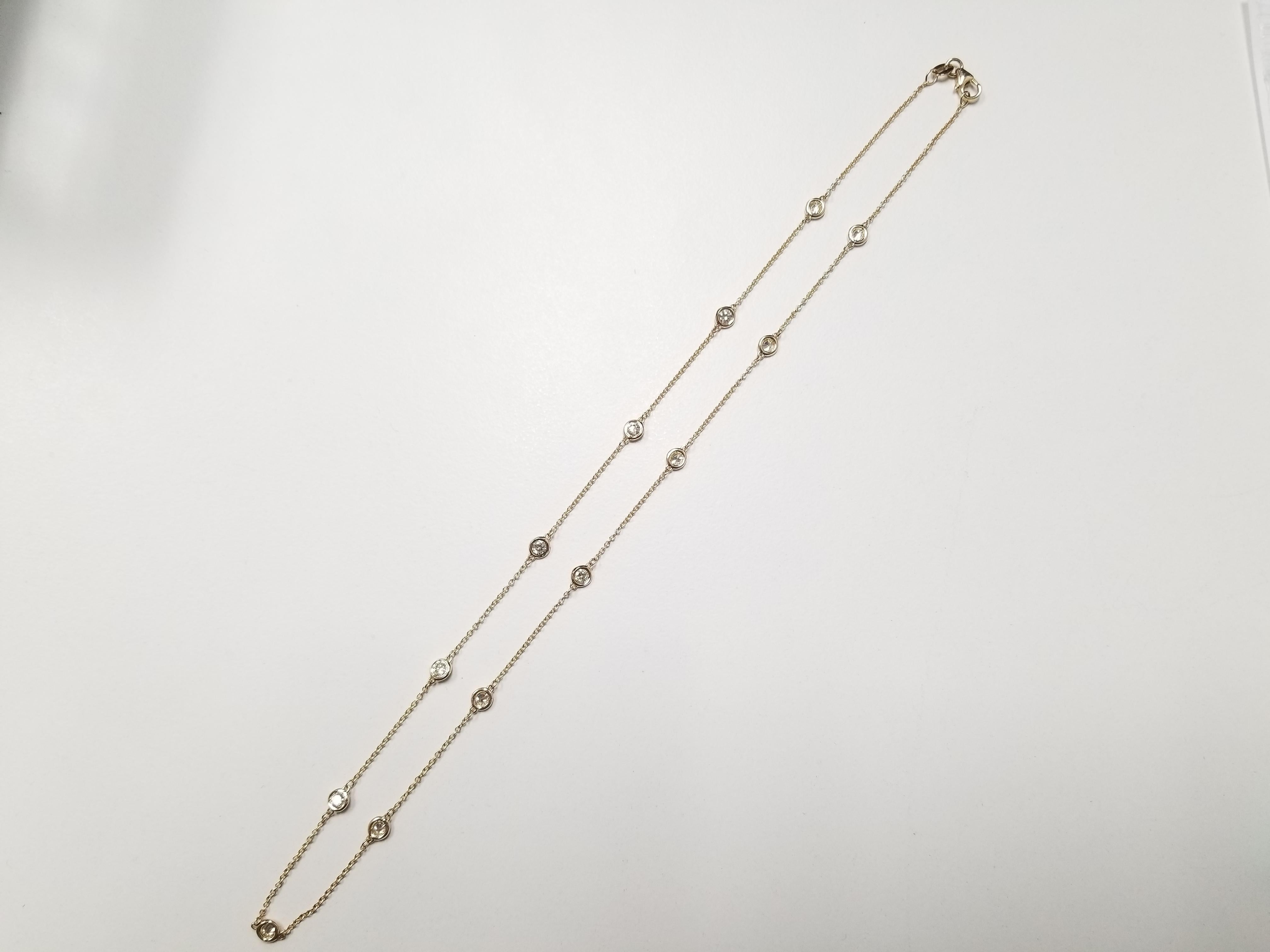 13 Station Diamond by the yard necklace set in Italian made 14K yellow gold. The total weight is 1.31 carats. Beautiful shiny stones. The total length is 18 inch.