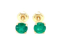 1.31 carats round Emerald Stud Earrings in 14K Yellow Gold.