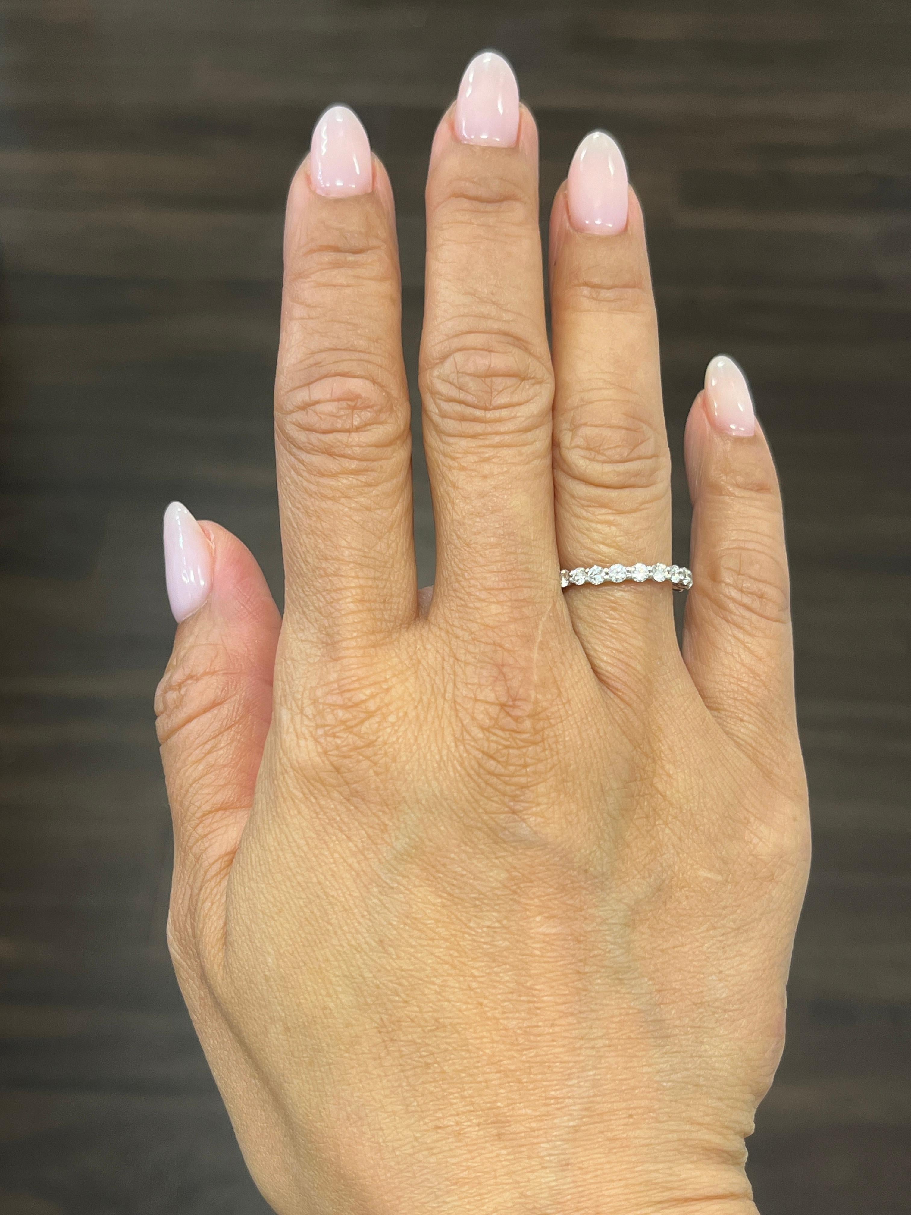 This beautiful eternity ring features 22 round brilliant diamonds set in 18k white gold. The diamonds boast a color of F/G and VS2/SI1 in clarity. A gorgeous ring to add to any wardrobe.