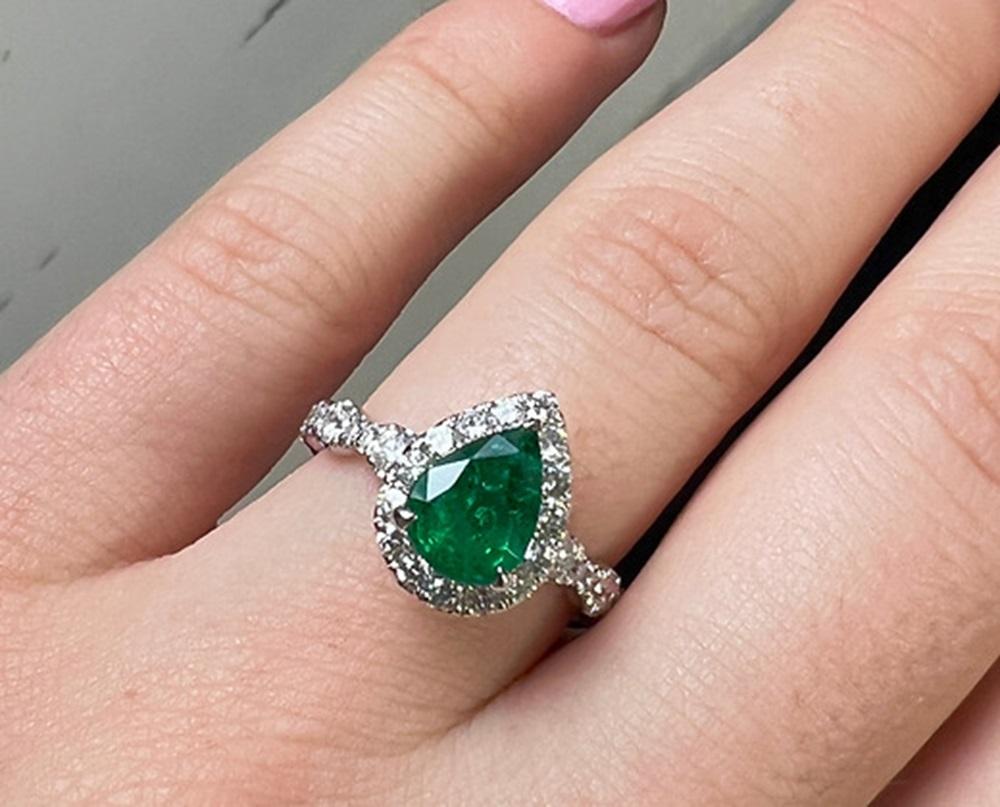 Emerald Weight: 1.31 CT, Measurements: 8.58 x 6.49 mm, Diamond Weight: 0.87 CT, Metal: 18K White Gold, Ring Size: 6.5, Shape: Pear, Color: Green, Hardness: 7.5-8, Birthstone: May