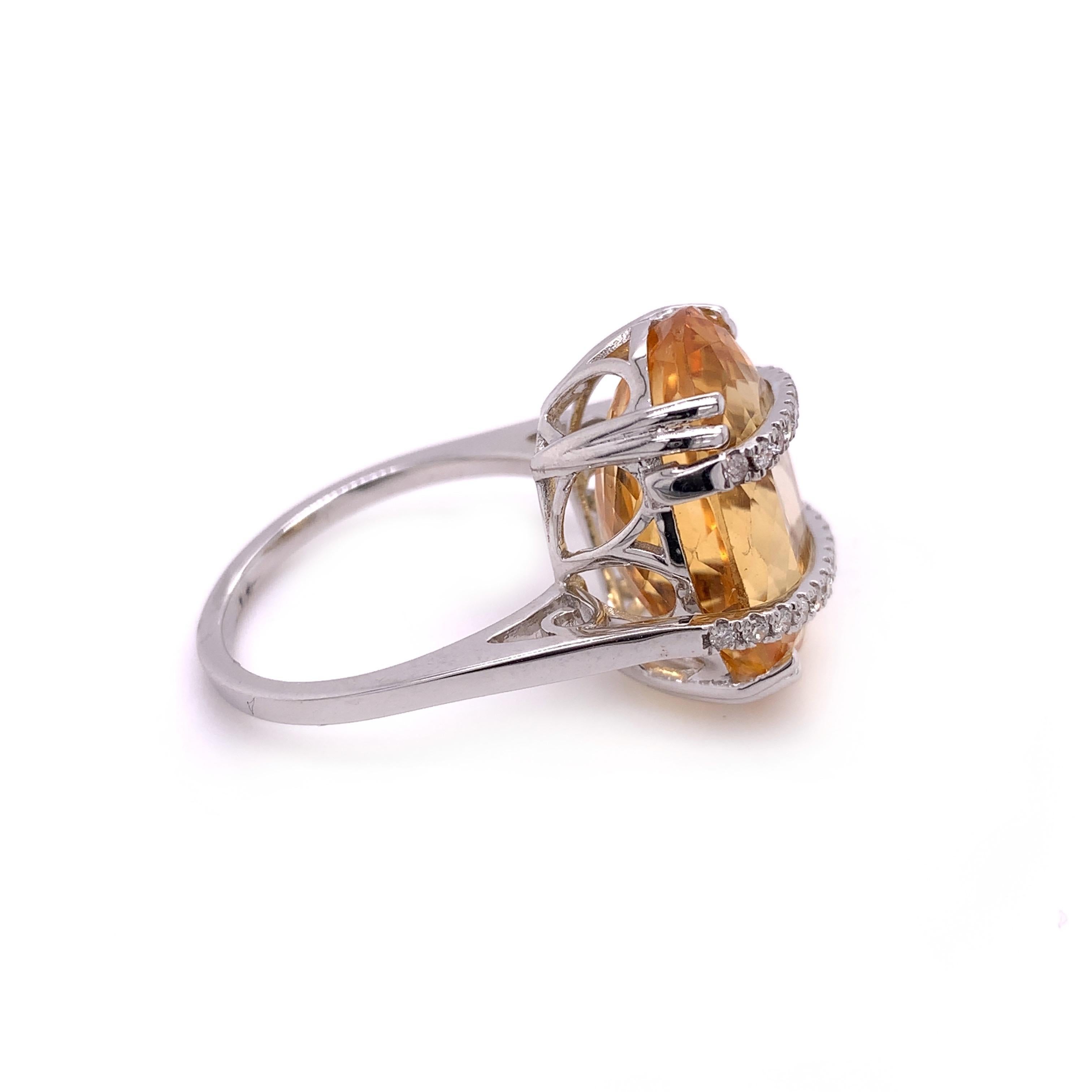 Glamorous citrine diamond ring. Sparkling, high luster, oval faceted, golden yellow, natural 13.11 carats citrine mounted in open basket high profile with eight bead prongs, accented with two rows of round brilliant cut diamonds. Handcrafted
