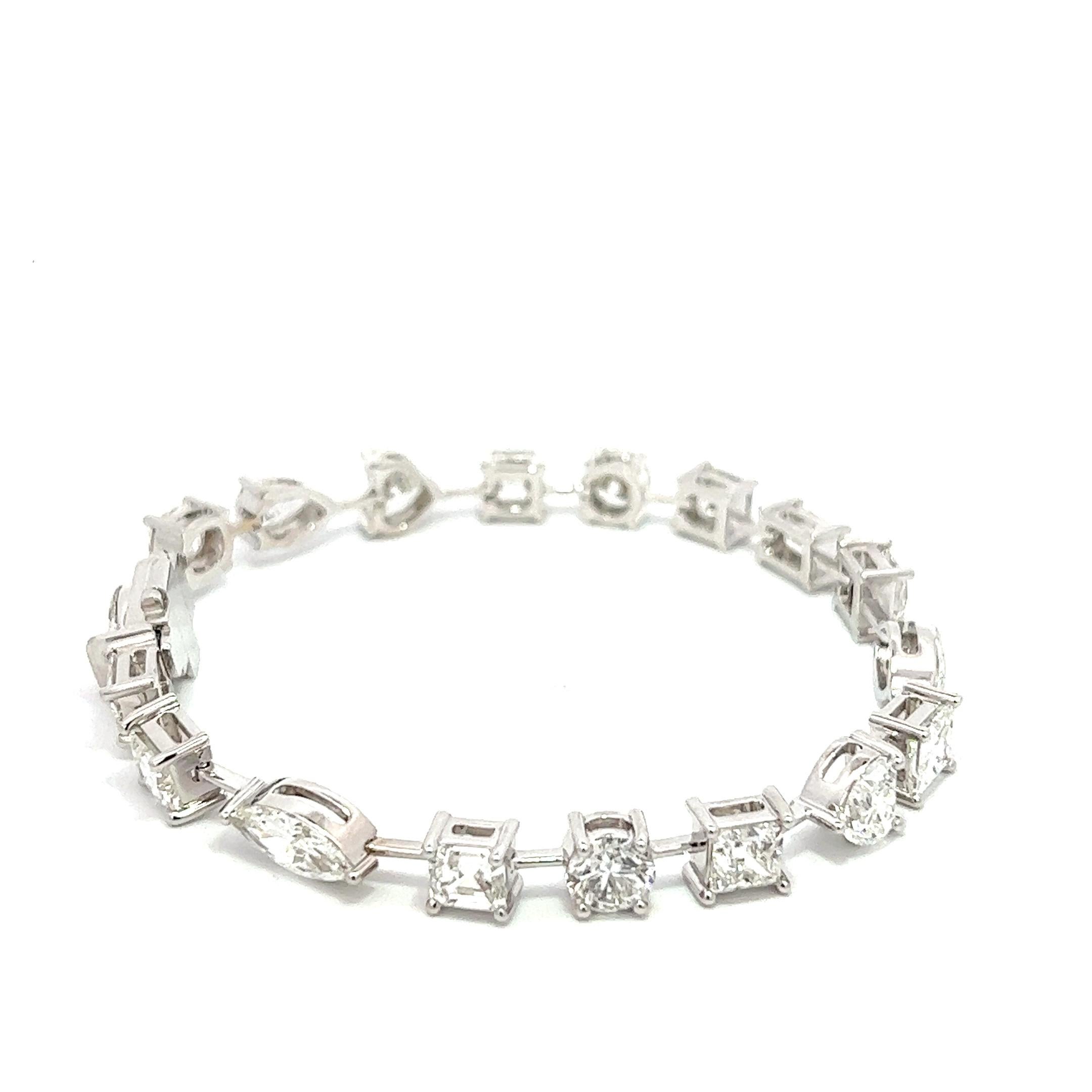 This stunning bracelet is truly one-of-a-kind, featuring a total weight of 13.11 carats of natural diamonds in various shapes. With 18 individual stones, each one is GIA certified, making this a truly high-end piece of jewelry. Crafted in 18k white