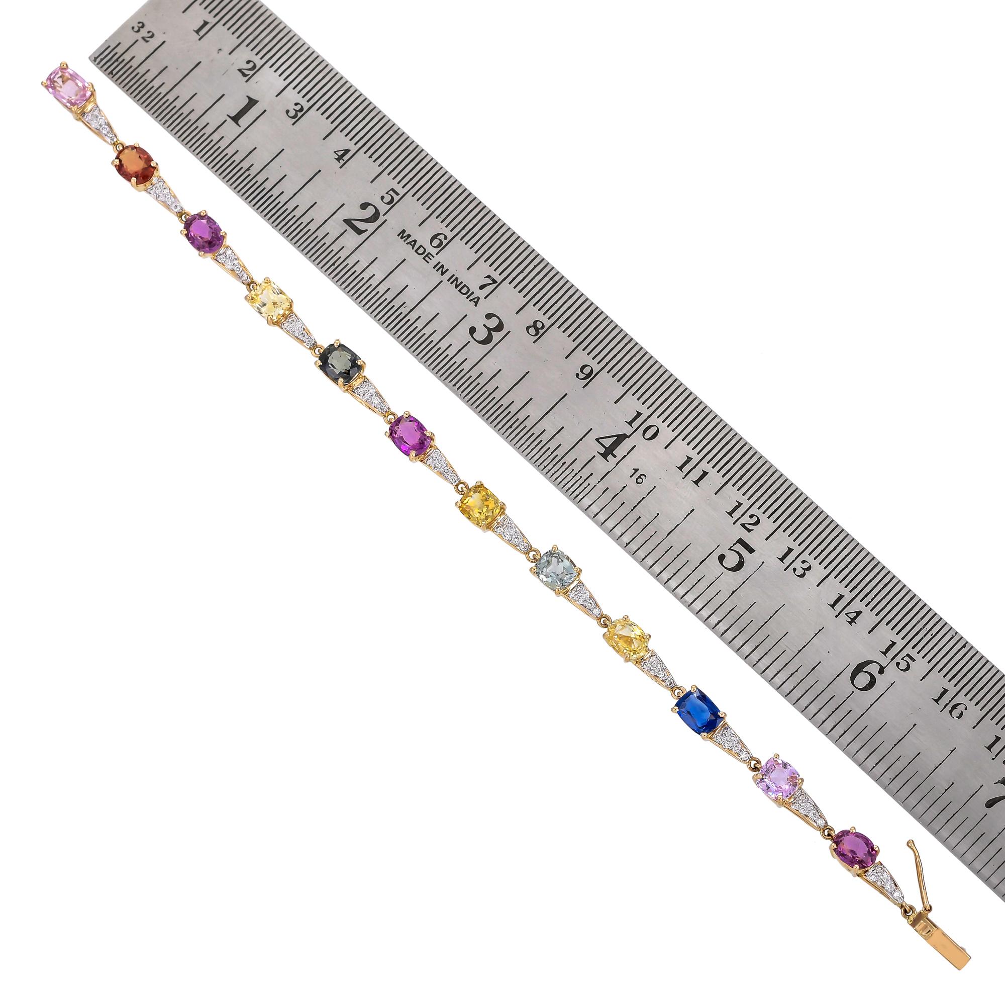 The flexible strap alternately set with 12 oval shaped multi sapphire weighing approximately 13.18 carats, and 72 round diamonds weighing approximately 0.49 carats, mounted in 18 karats yellow gold. A simple yet fashionable bracelet to take you