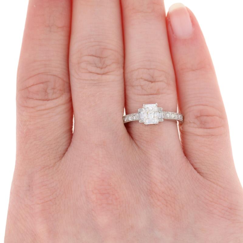 Celebrate your unique love story in style! Consisting of an engagement ring and contoured wedding band, this 14k white gold bridal set hosts a GIA-graded diamond solitaire and sparkling diamond accents which are highlighted by milgrain borders. 
