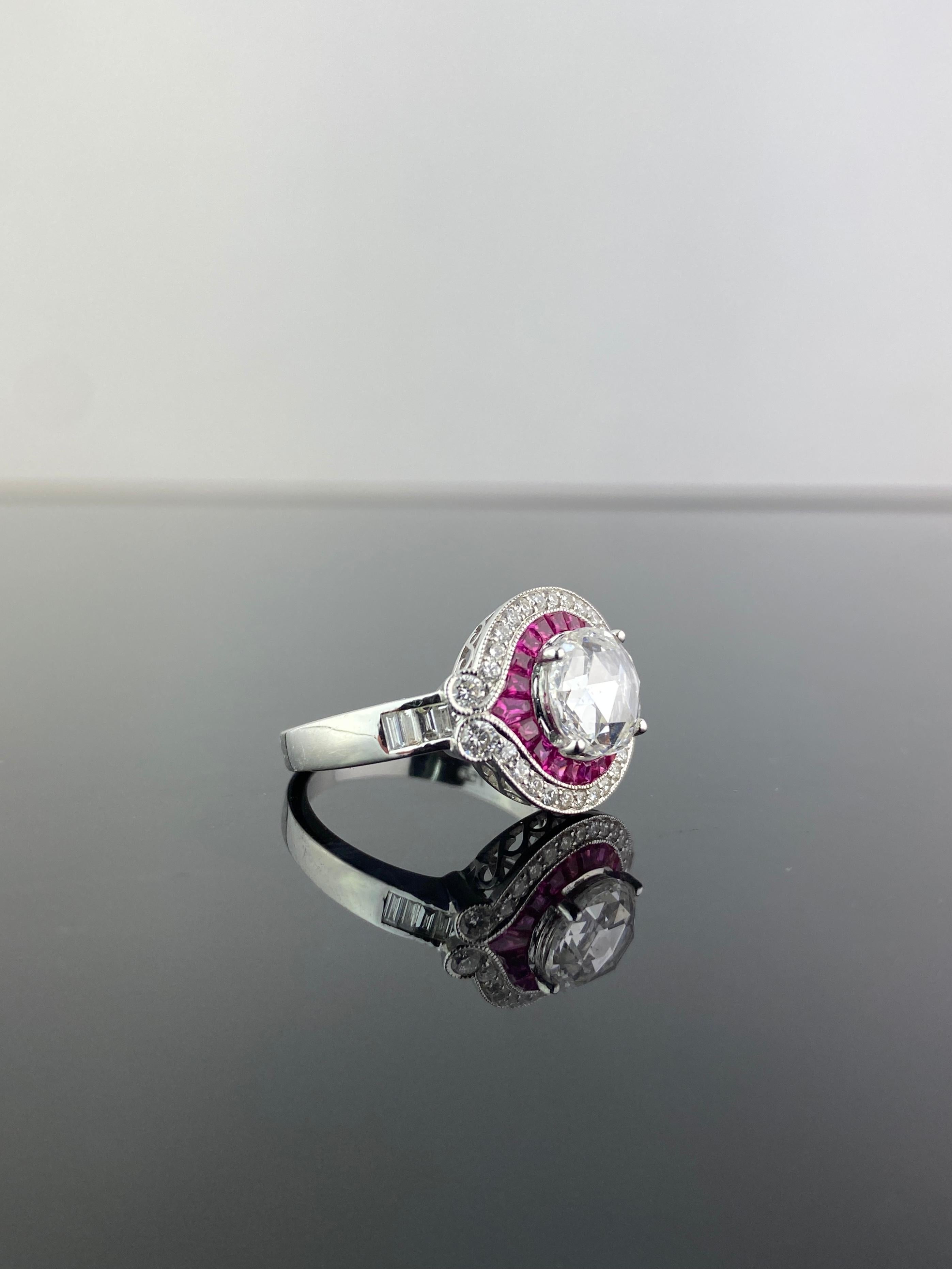 A very unique, art-deco looking 1.32 carat round rose-cut Diamond and Ruby solitaire engagement ring. The rubies are cut precisely to fit in the mounting, giving it an impeccable overall look. A total of 0.48 White Diamonds and 0.75 carat Rubies are