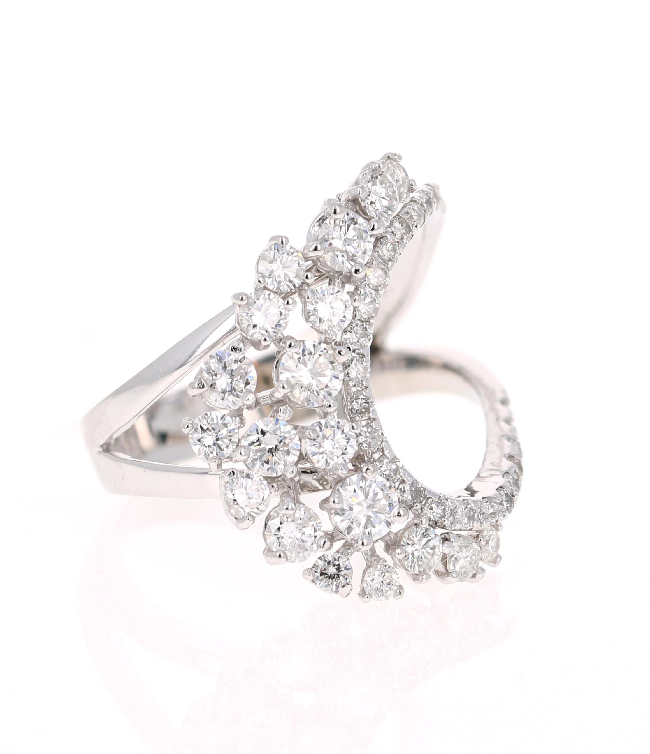 Classy Cocktail Ring with Diamonds. 

This ring has 43 Round Cut Diamonds that weigh 1.32 Carats and has a clarity and color of SI-F.  
It is crafted in 14 Karat White Gold and has an approximate weight of 5.3 grams. 

The ring is a size 7 and can