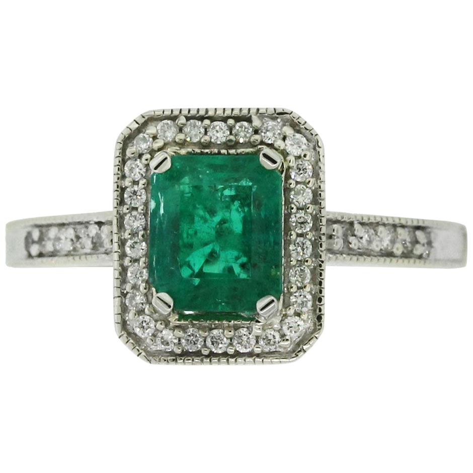 1.32 Carat Emerald Cut Emerald Diamond Halo Ladies Ring