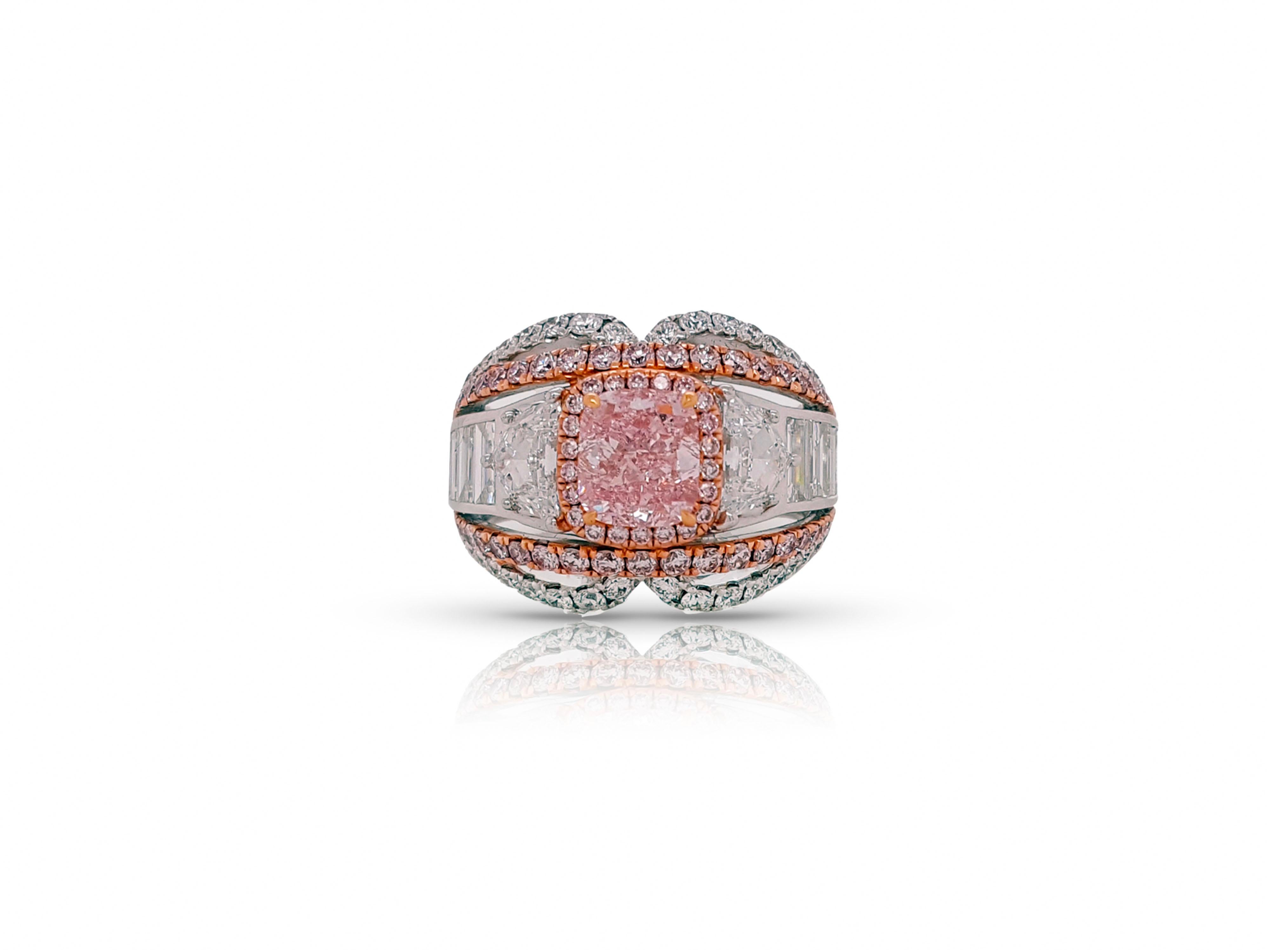 A remarkable 4.74 Carat total Engagement and cocktail diamond ring with a unique design that will leave admirers fawning from near and far. Showcasing GIA Certified 1.32 carat Fancy Intense Purple-Pink Diamond Cushion Cut, SI2 clarity, Flanked by
