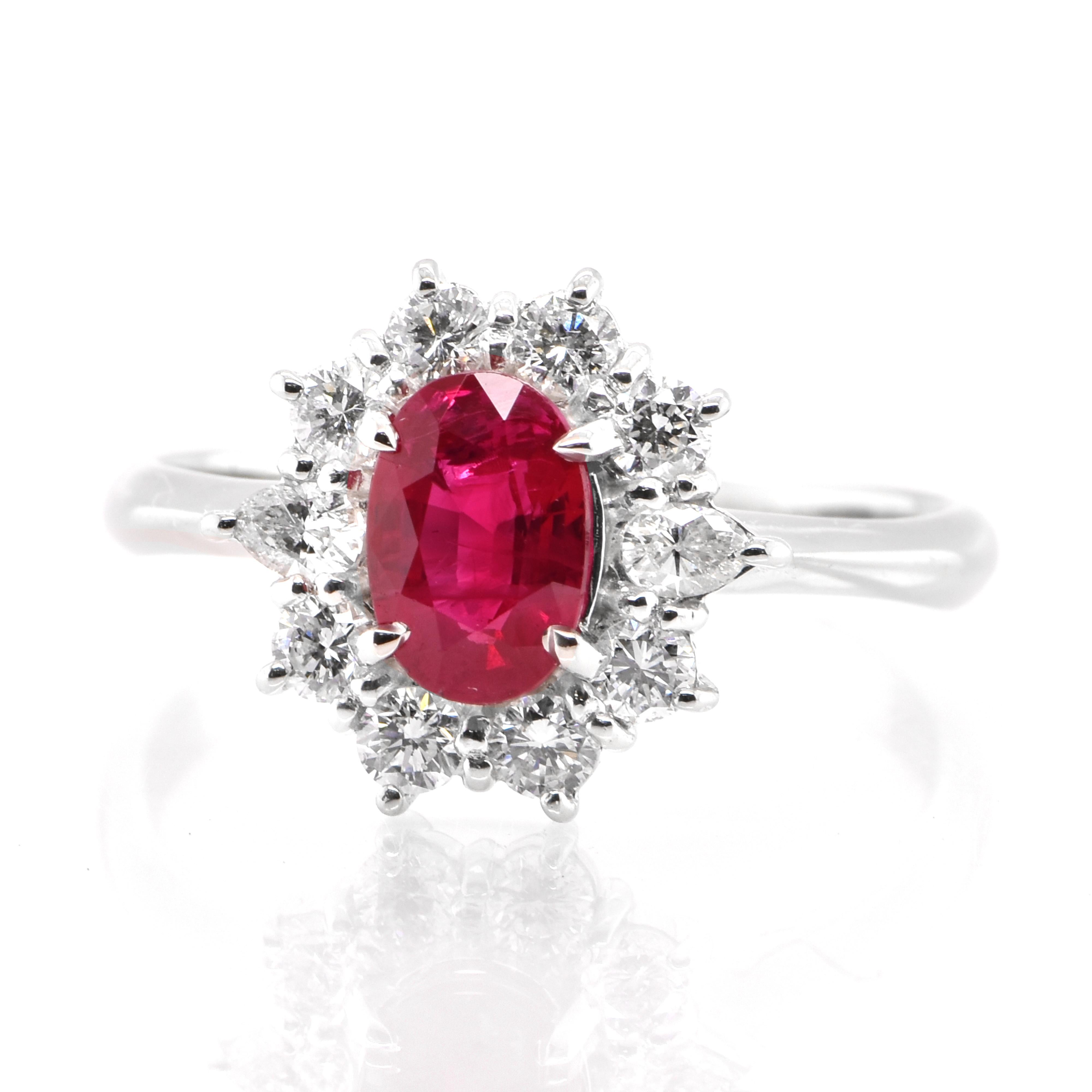 A beautiful Engagement Ring set in Platinum featuring a 1.32 Carat, Natural Ruby and 0.61 Carats of Diamond Accents. Rubies are referred to as 